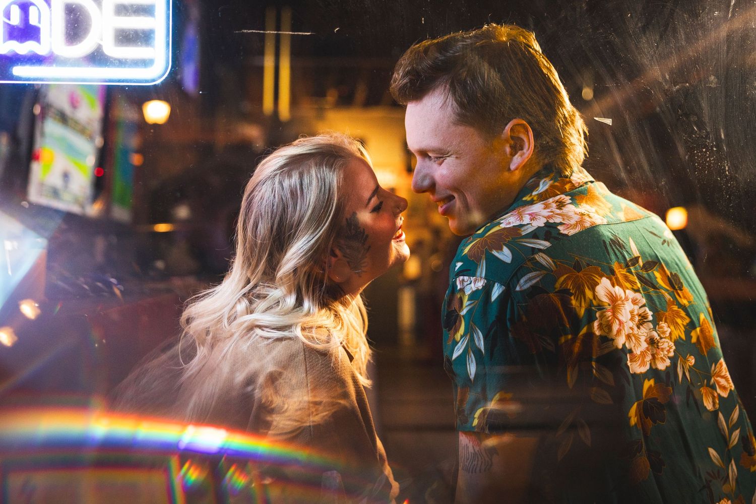 Nighttime dance scene with colorful bokeh lights creating a romantic atmosphere.