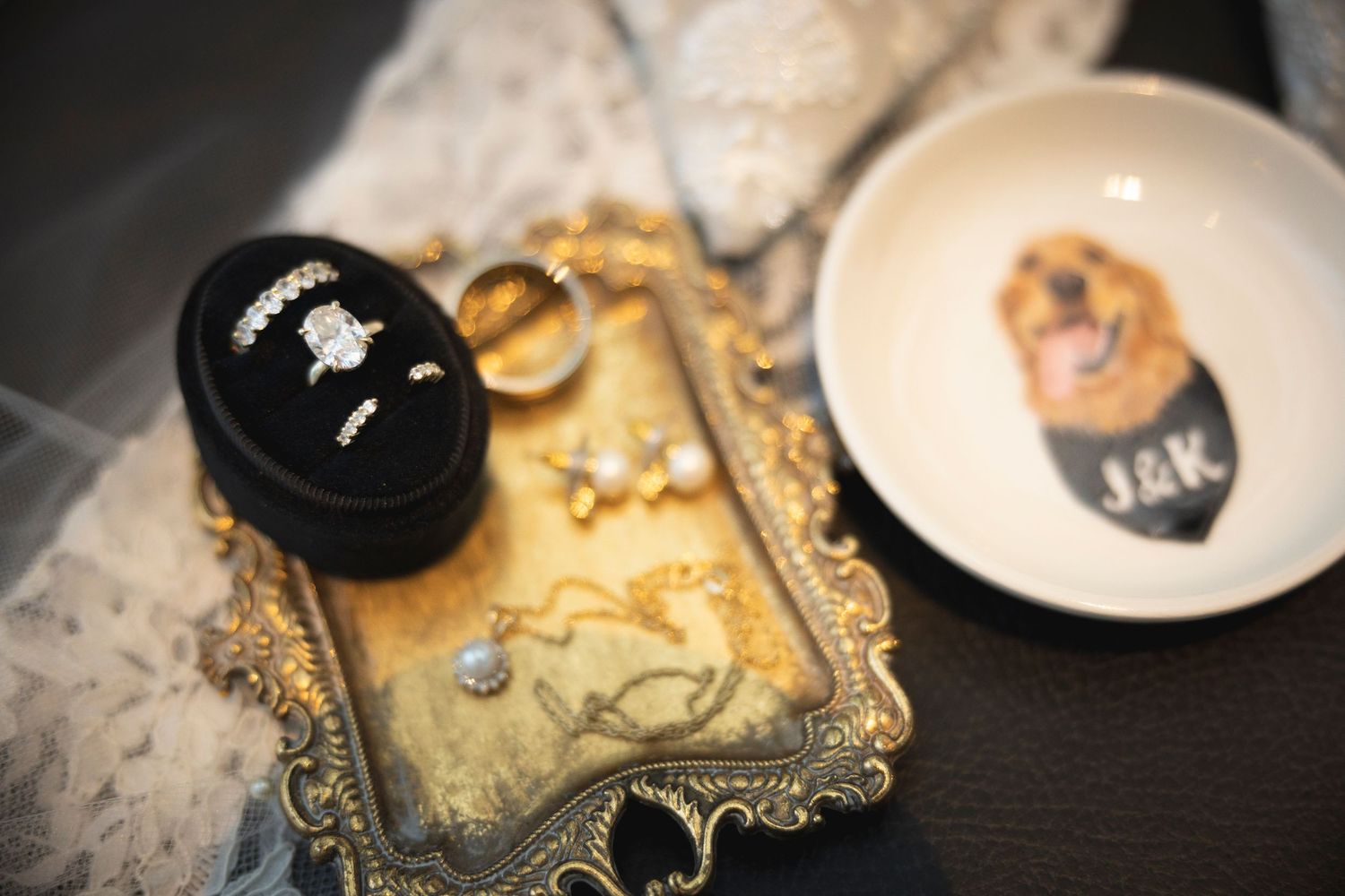Close-up of ornate gold frames and wedding stationery details.