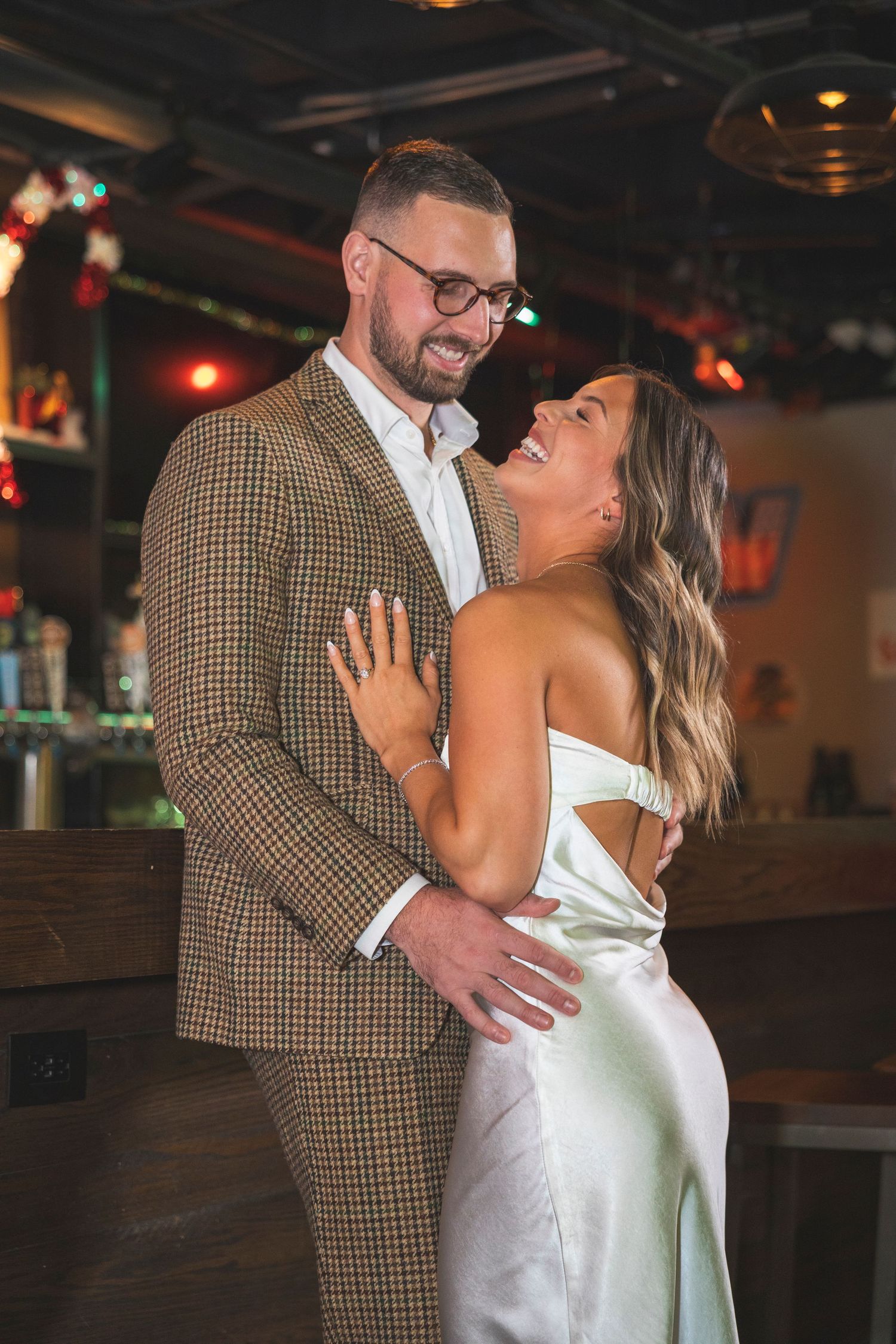 Romantic dance sequence in a dimly lit bowling alley showing moments of joy and affection.