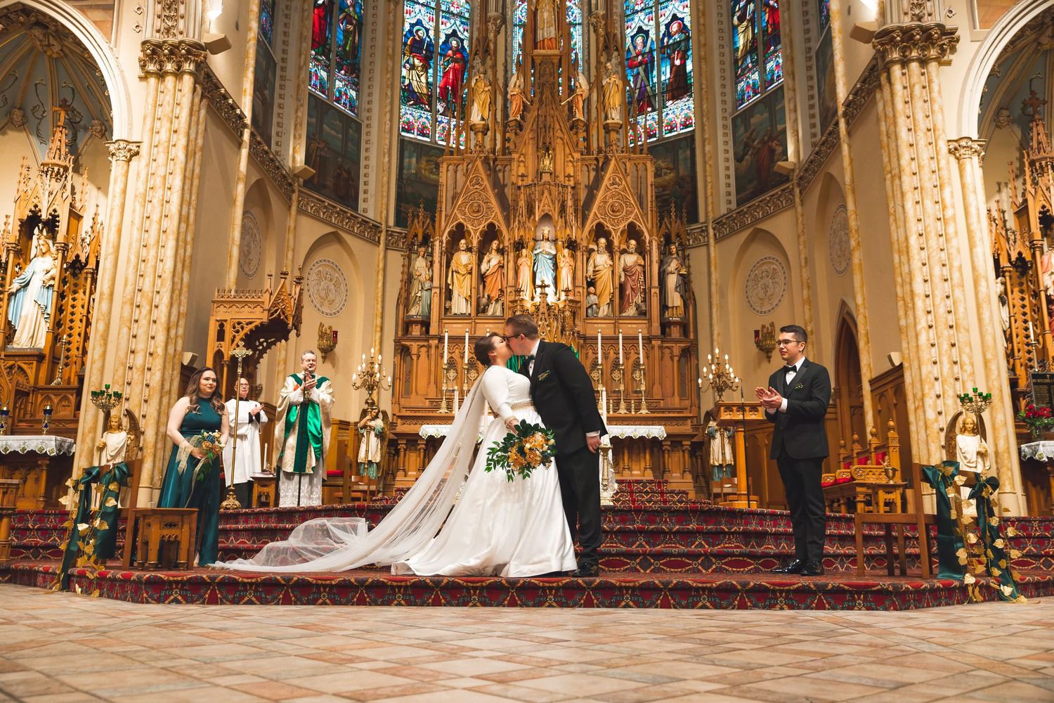 Wedding ceremony sequence in a gothic church with stunning stained glass windows and ornate details.