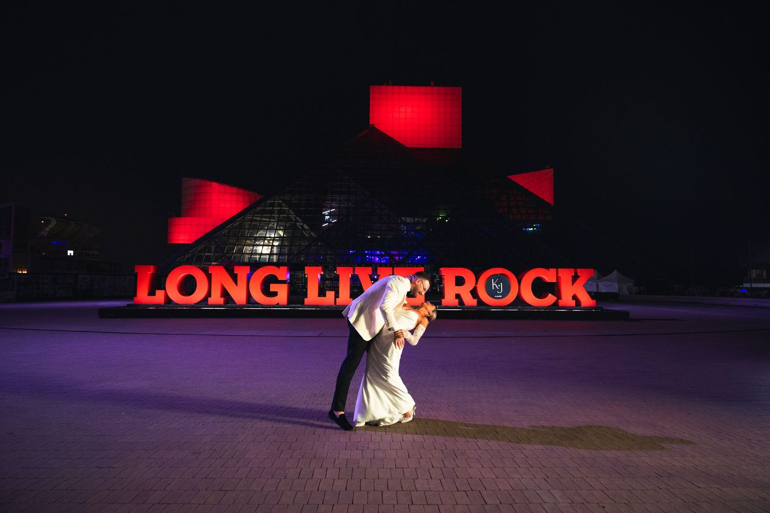 Red neon signage glows brightly against a dark nighttime background.