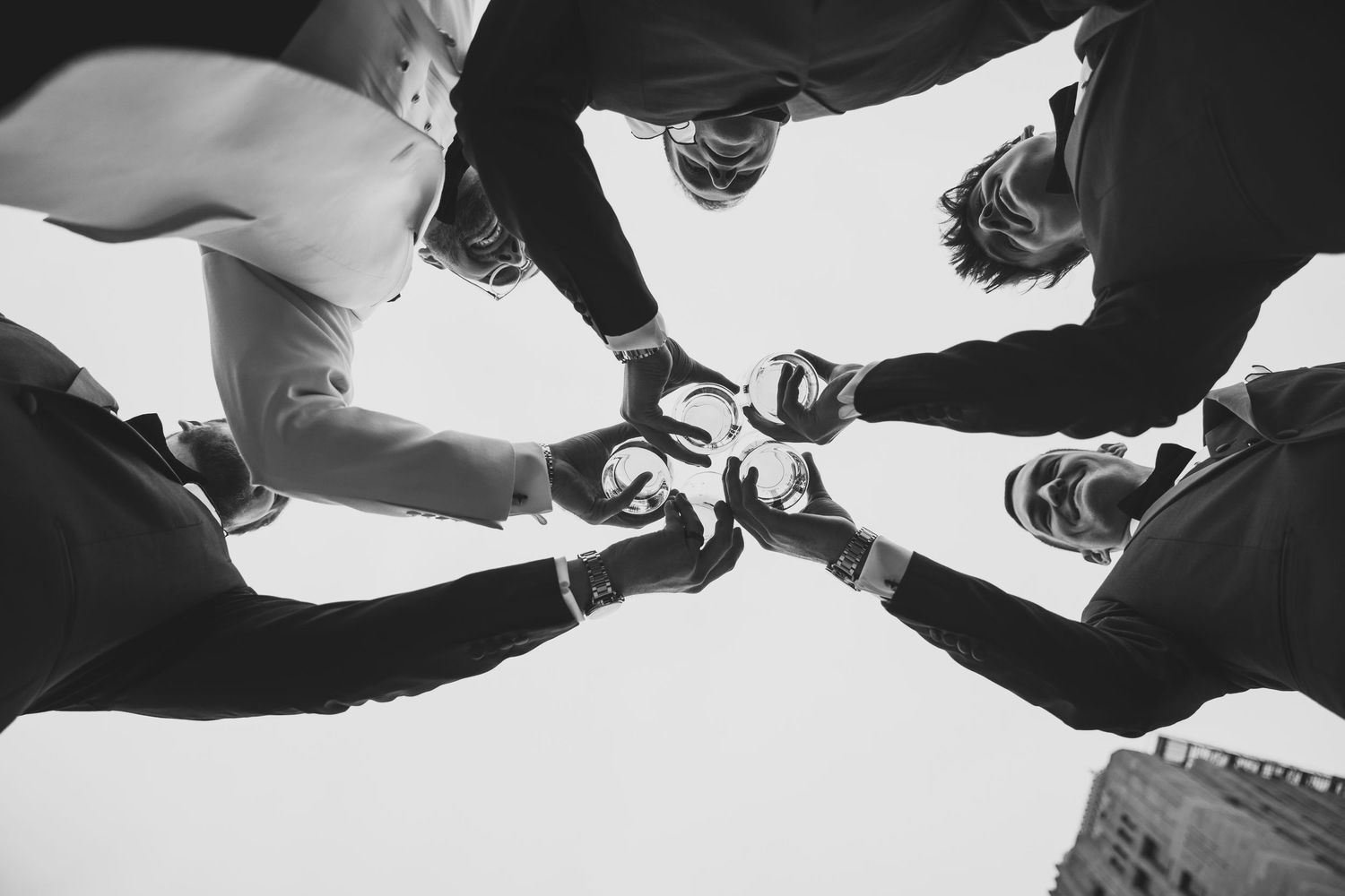 Black and white photo of dancing feet on a wedding reception dance floor.
