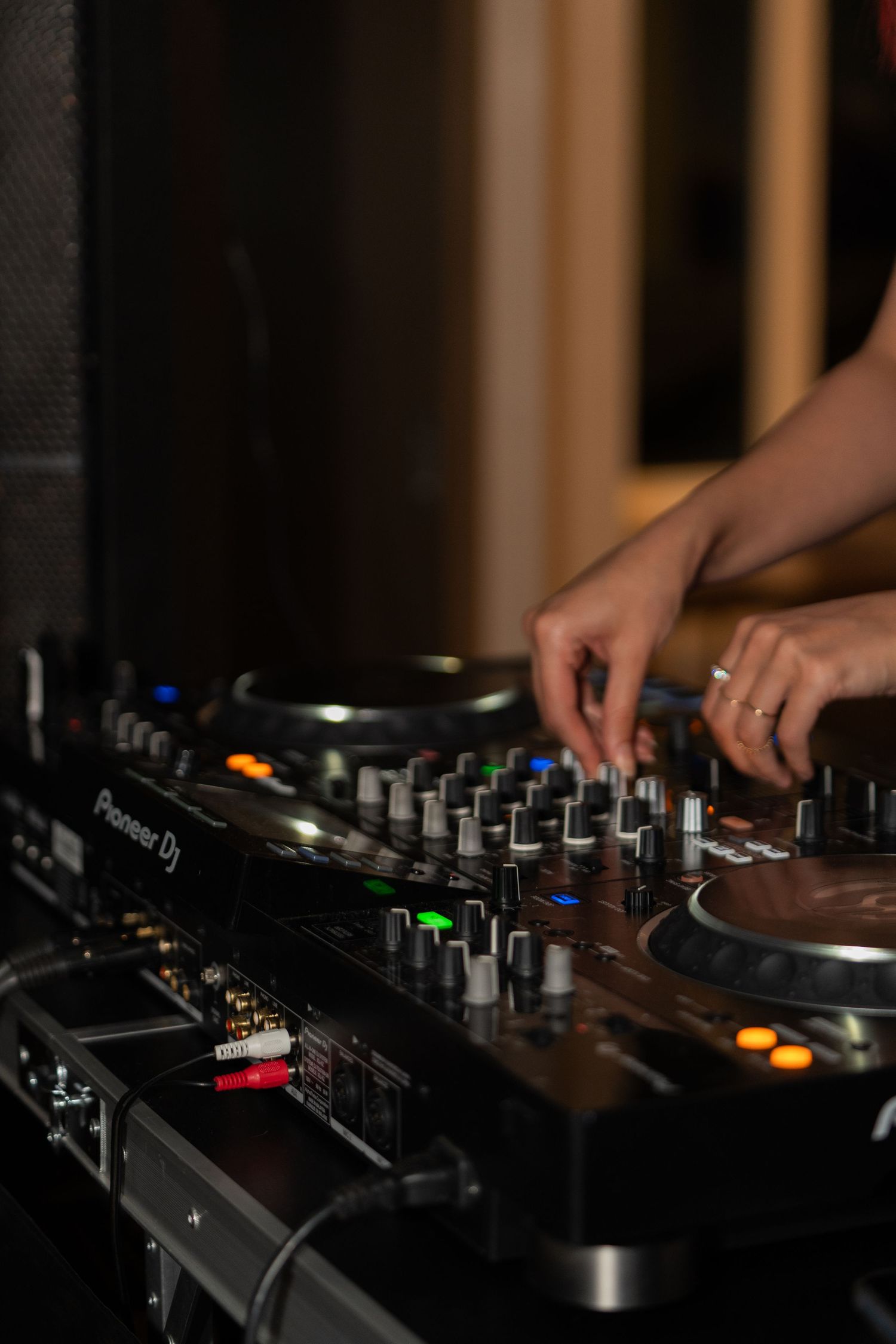 Close-up shots of DJ mixer controls and knobs showing various faders and buttons in low light conditions.