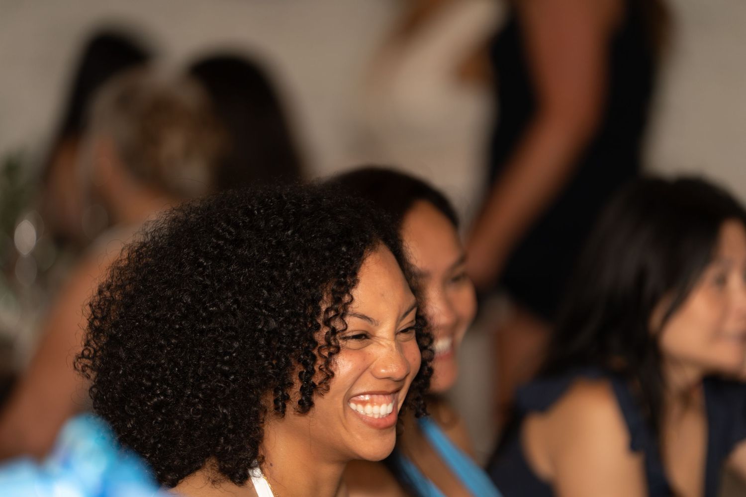 A joyful moment captured at what appears to be a social gathering or celebration.