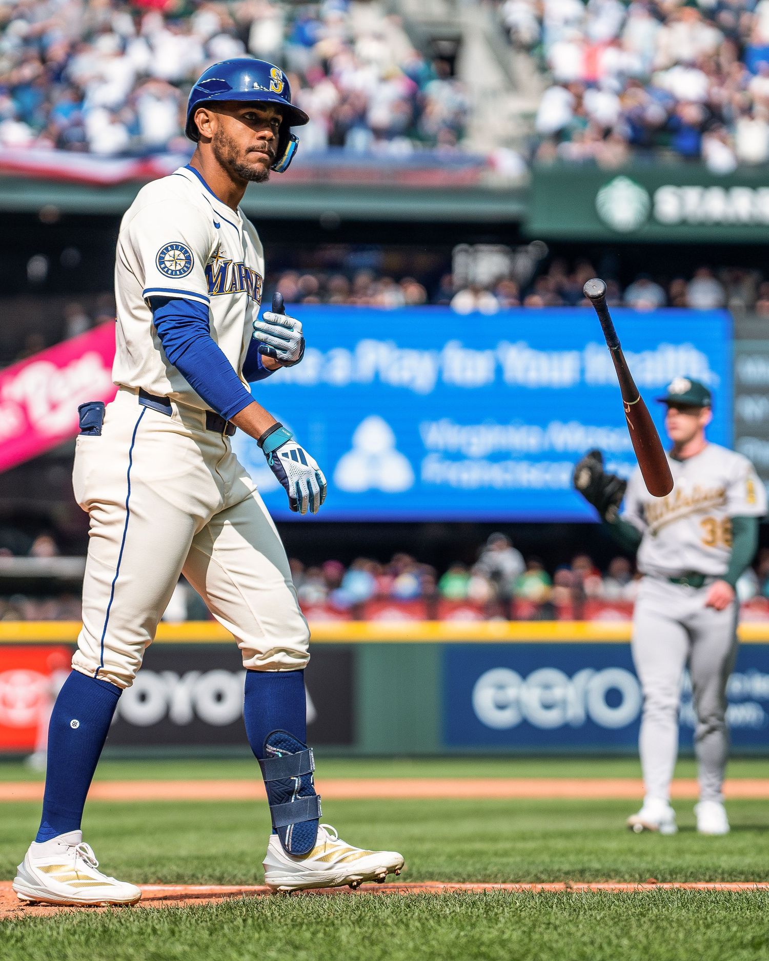 Julio Rodriguez (44) of the Seattle Mariners Flips hi bat after hitting his first home run of the year at T-mobile park in Seattle in Oct 22