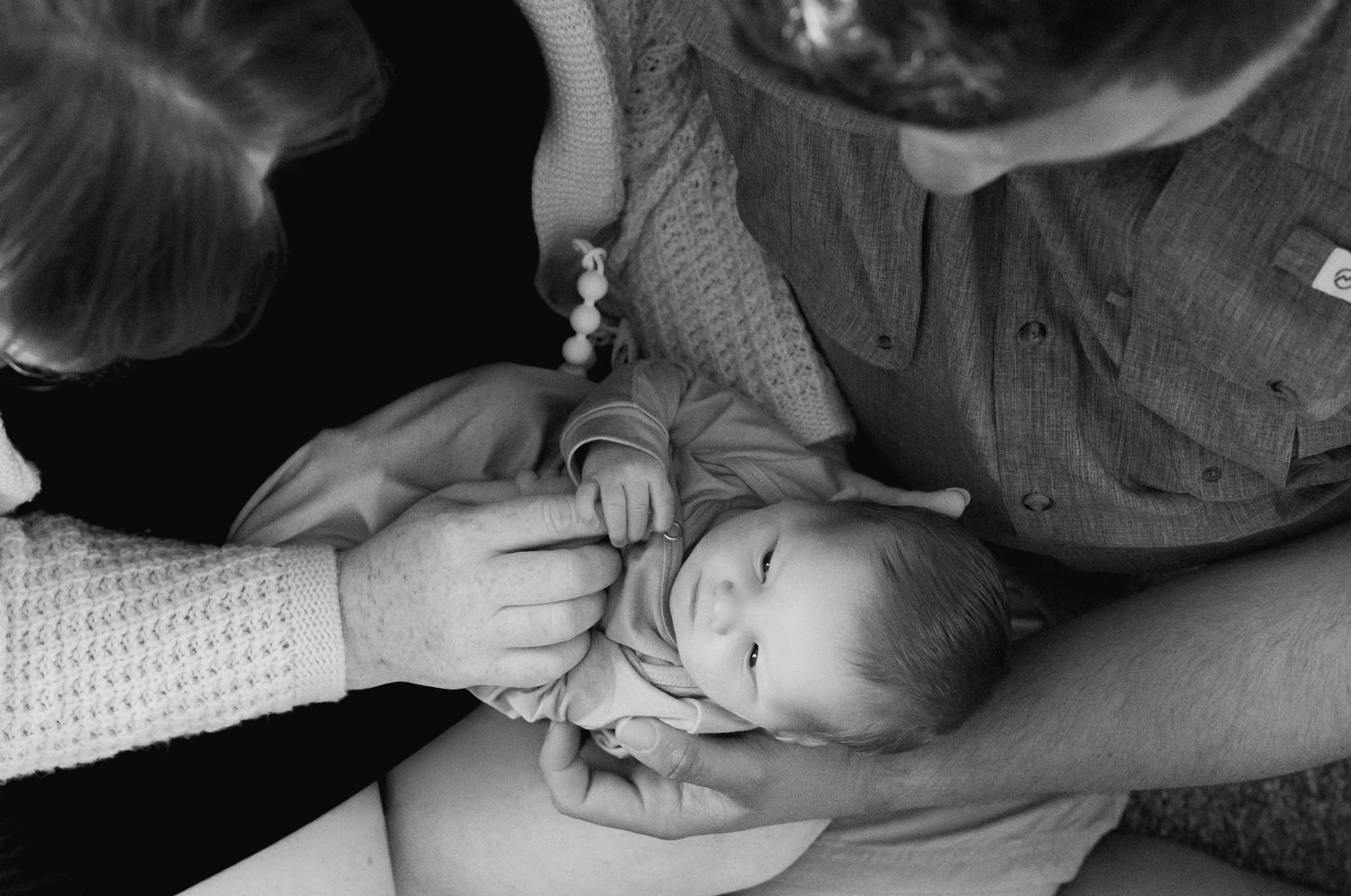 In home fresh48 mom and dad holding newborn