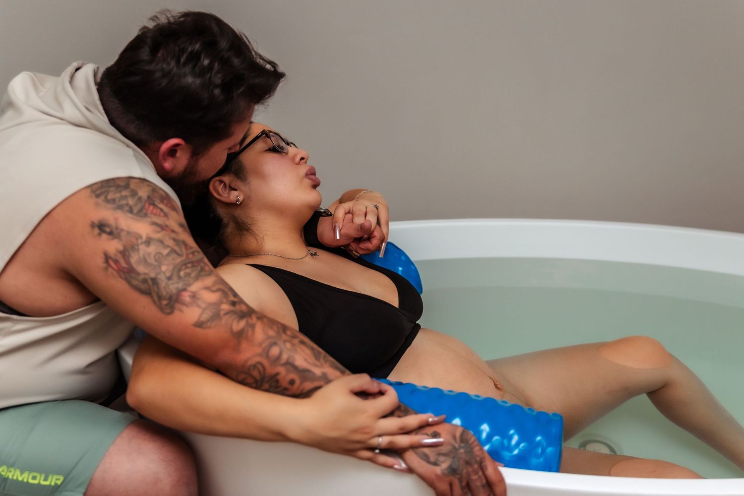 mom relaxing in tub in birth center birth