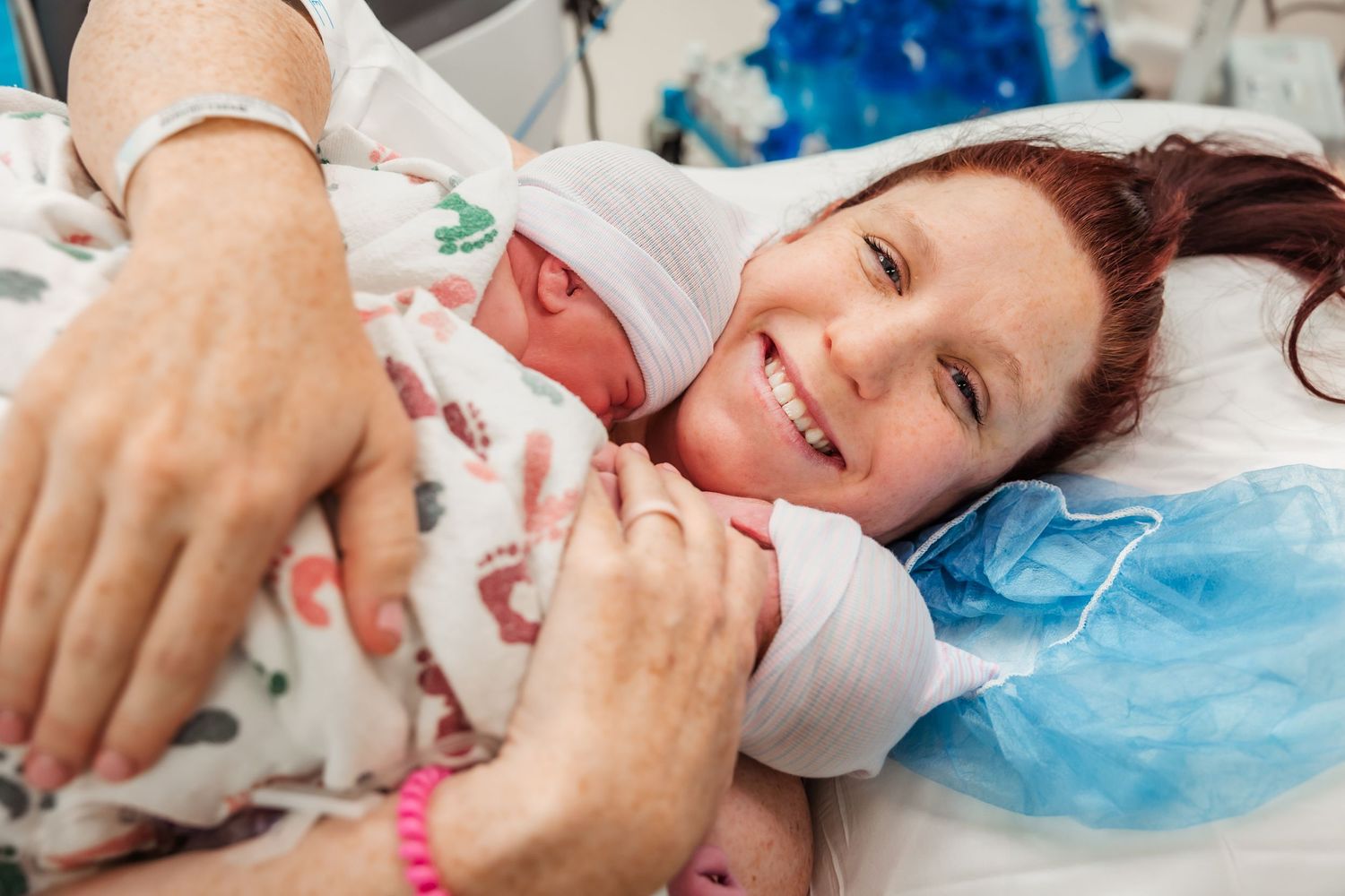 Beaming with pride and joy after a boy/girl twin vaginal delivery