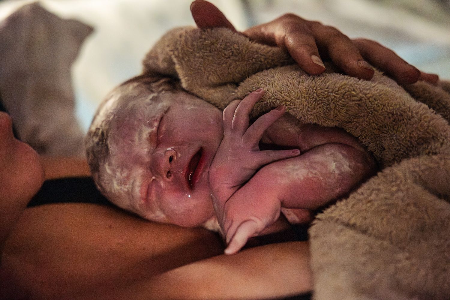 baby covered in vernix after a home birth in Odessa