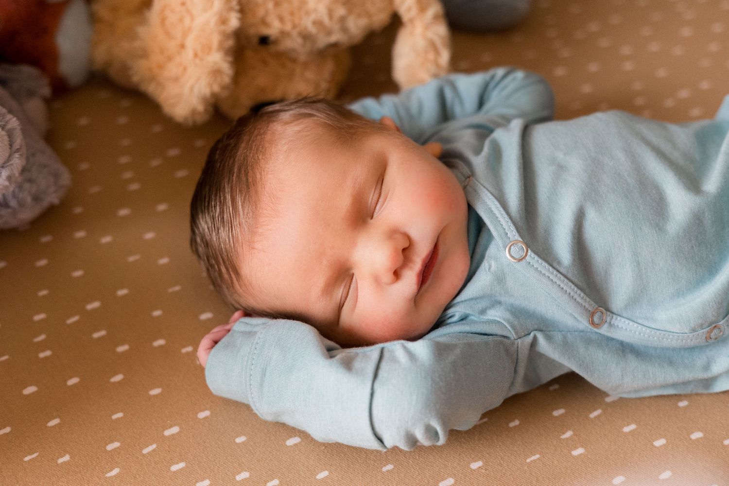 A newborn sleeping during fresh 48 session