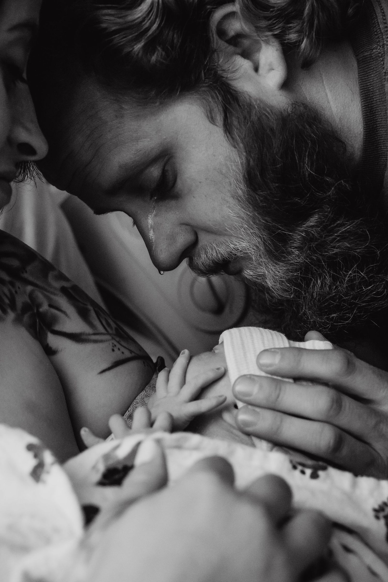 dad crying after the birth of his baby