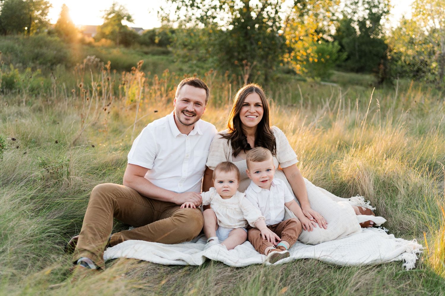 Family portrait session in a golden field during sunset with warm autumn colors.
Niagara family photos.