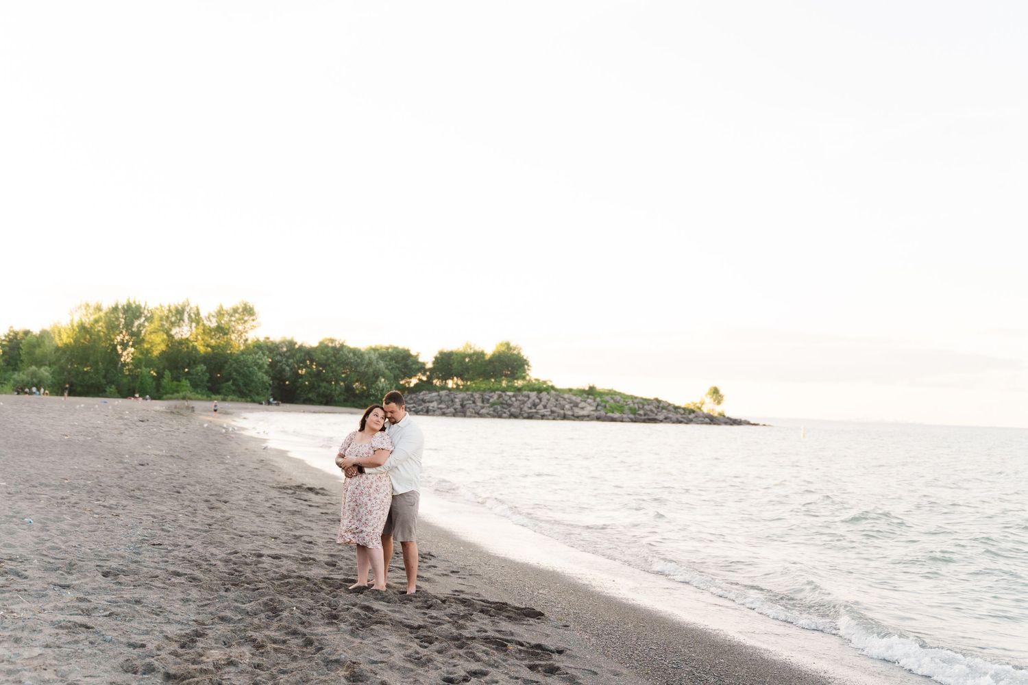 Scenic beach landscape with water and trees during golden hour.
Niagara engagement photos