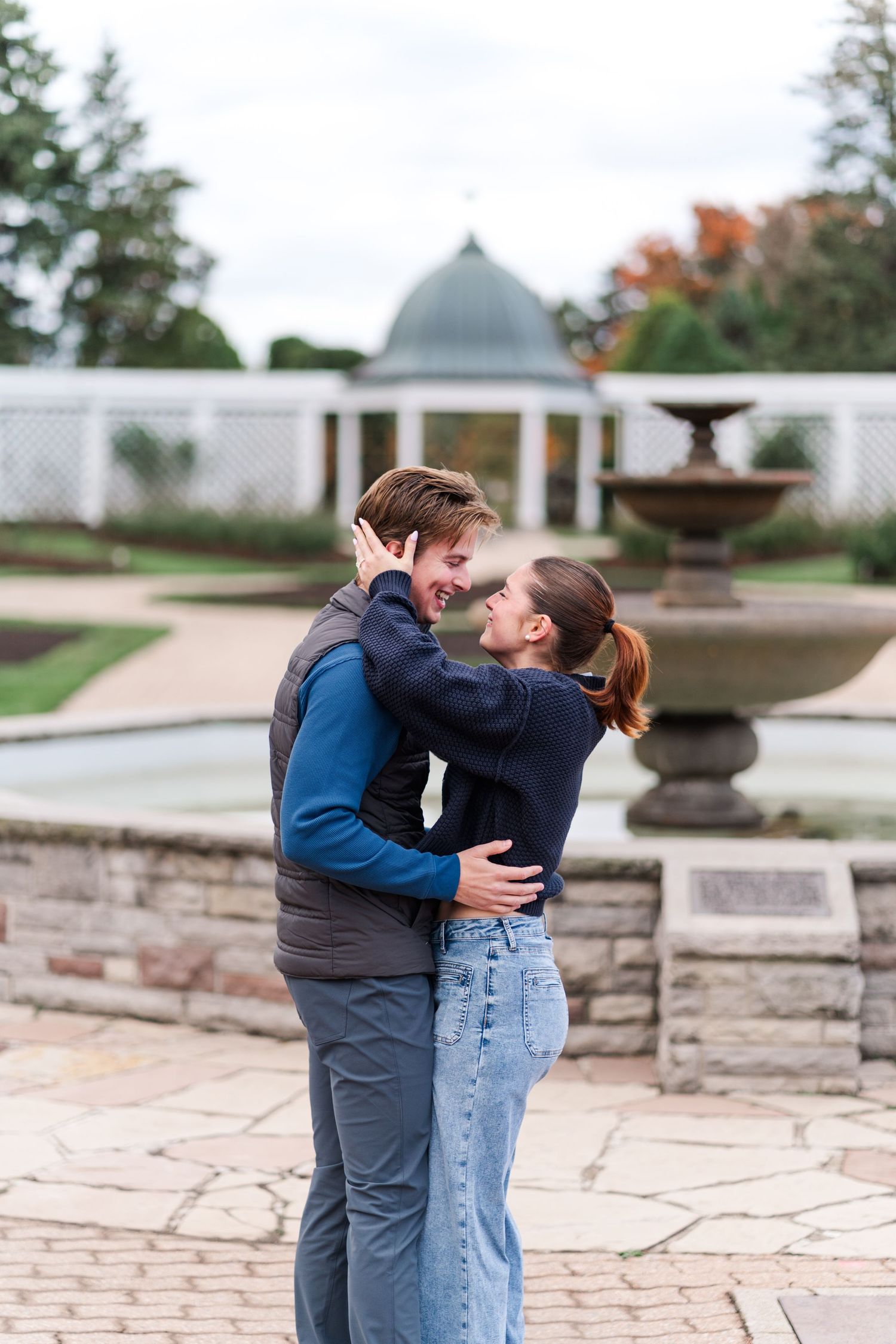 A romantic engagement photo session captured at a stone patio with architectural details in the background.
Niagara Proposal photos