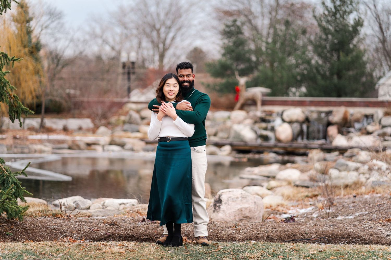 A family photoshoot in an outdoor setting with stone walls and autumn foliage.
Niagara Engagement Photos