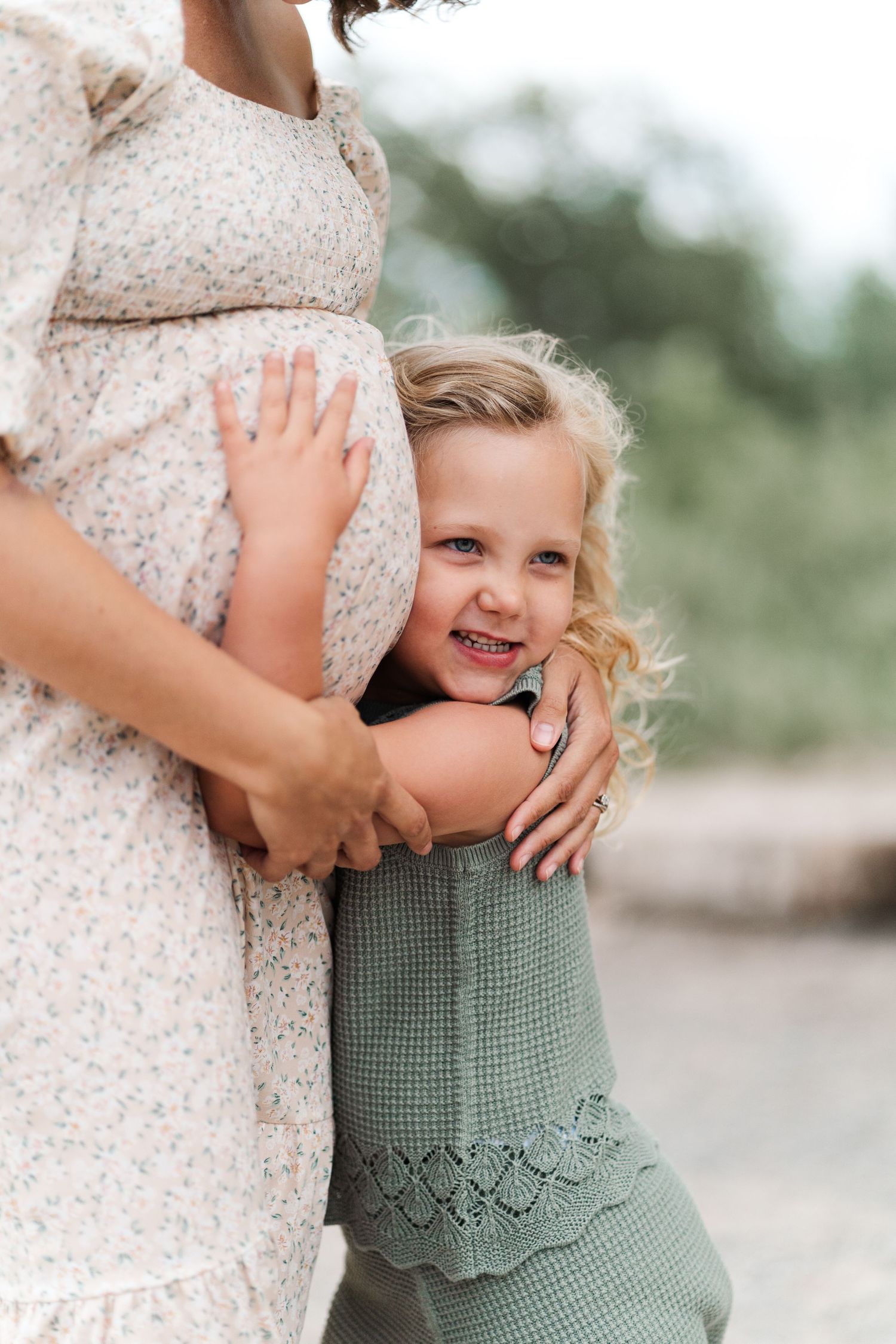 A tender moment captured between mother and child in soft natural lighting.
Niagara maternity photos.