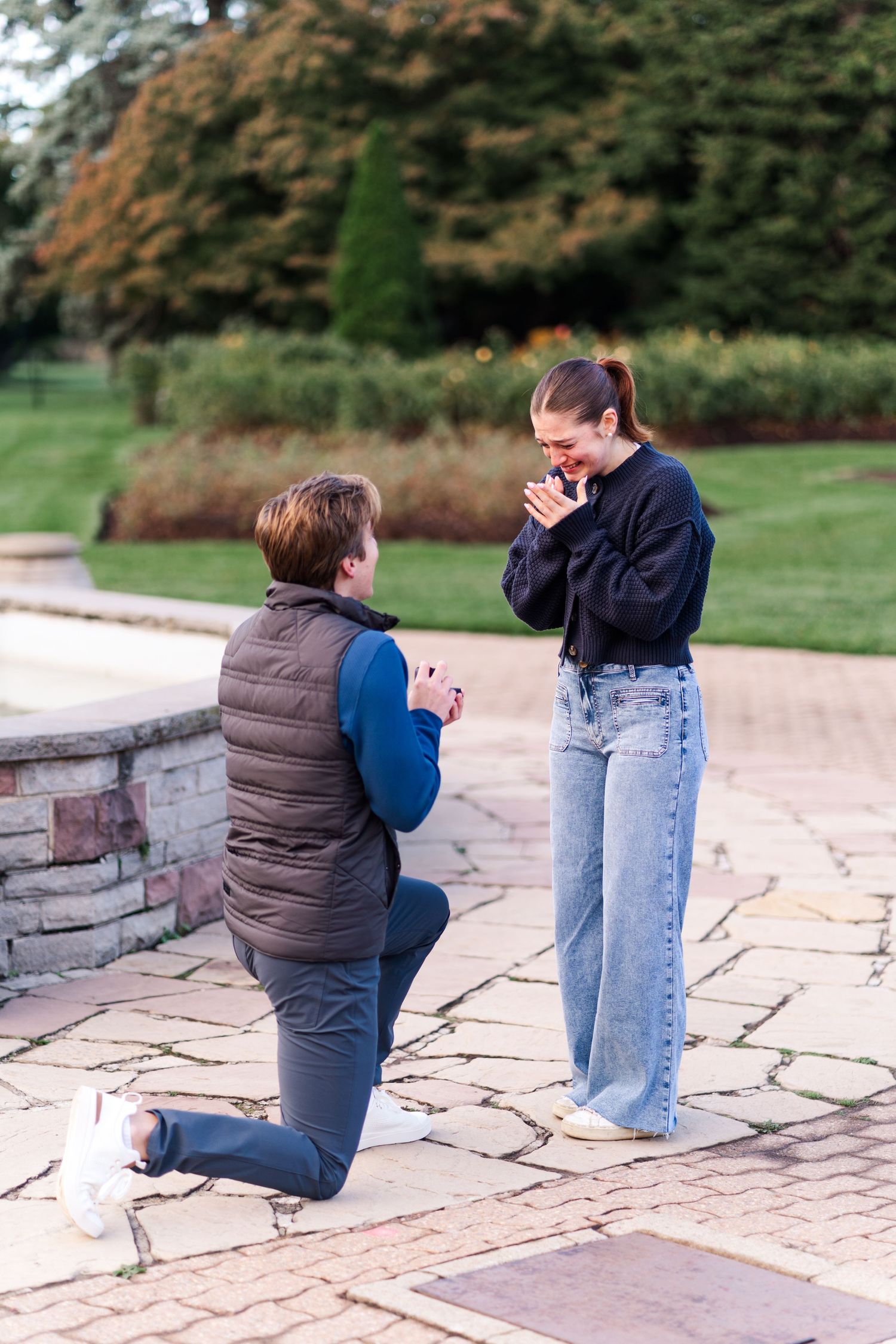 A heartfelt proposal moment on a stone patio during golden hour.
Niagara proposal photos.