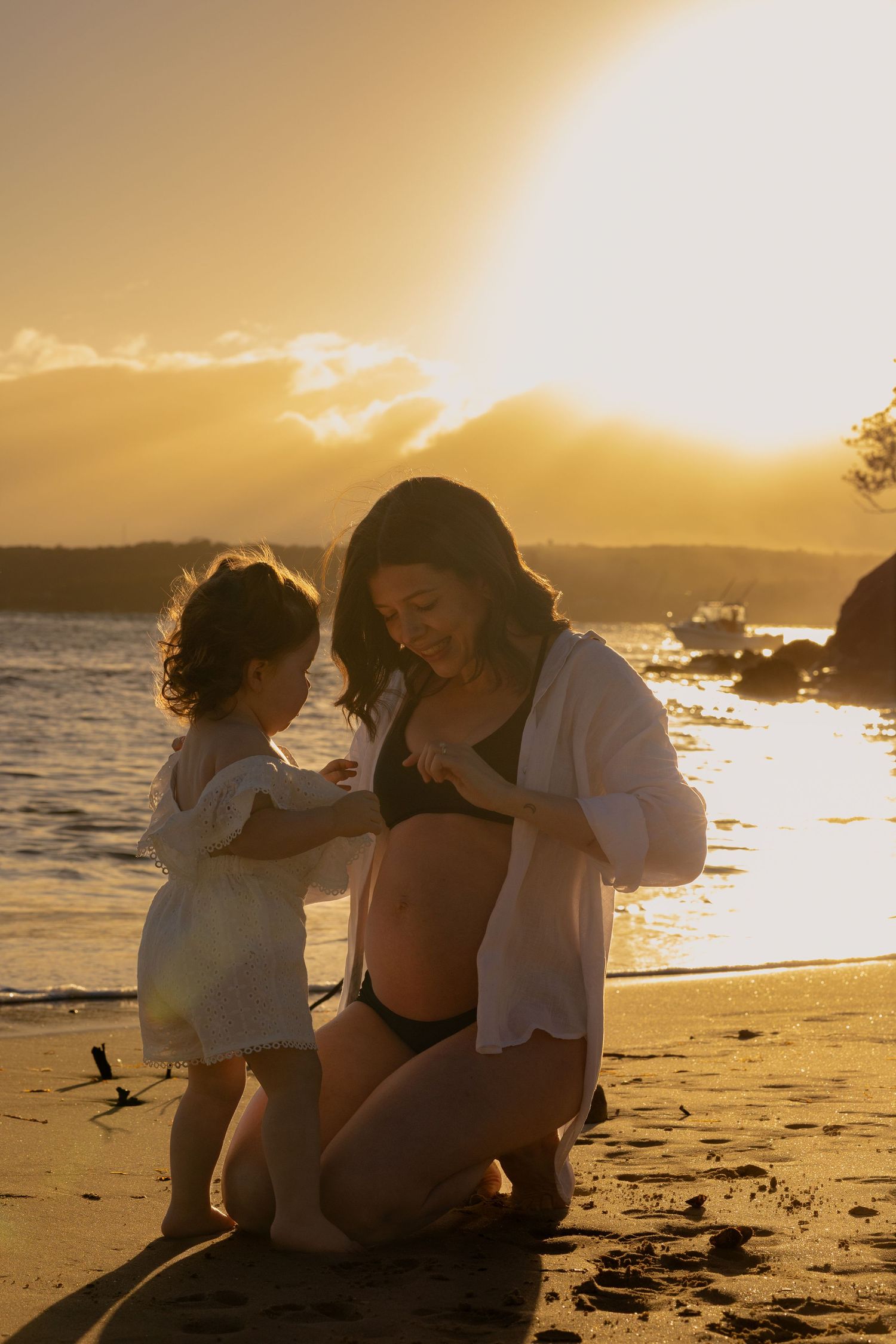 Pregnant woman on Balmoral Beach with her toddler
