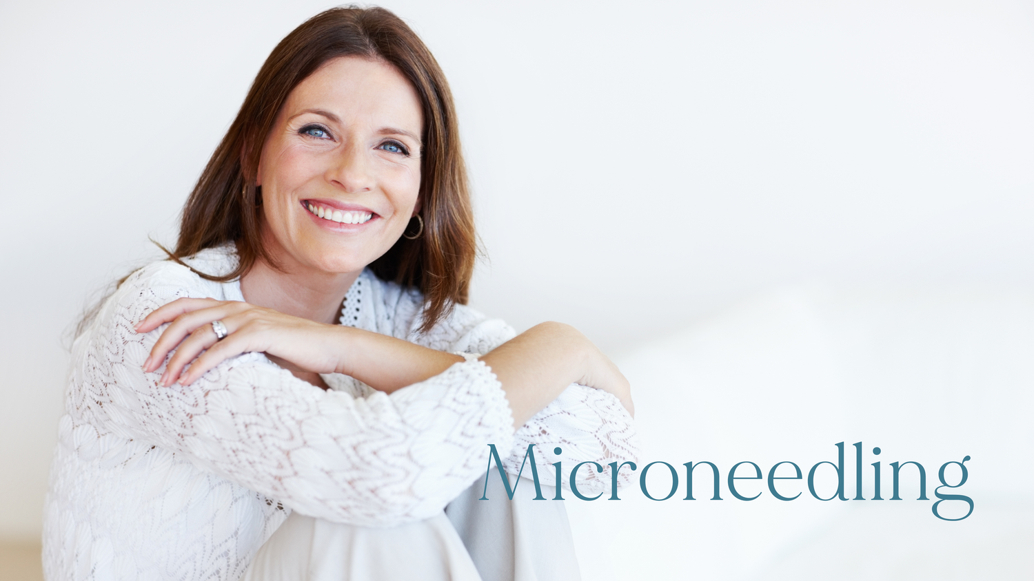 Smiling woman with arms crossed promoting microneedling skin rejuvenation treatment at a med spa.