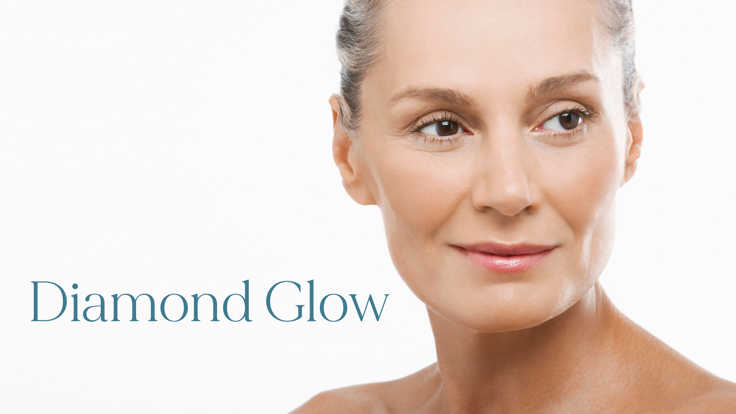 Elegant mature woman showcasing Diamond Glow facial treatment results with radiant, smooth skin.