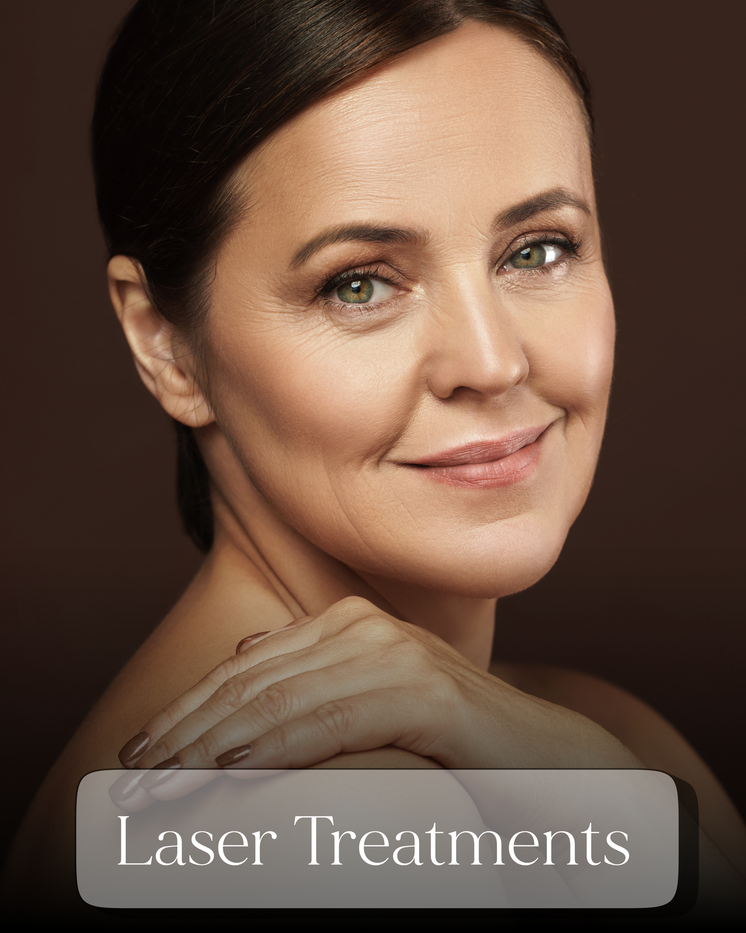 Middle-aged woman with glowing skin smiling softly, representing laser treatments at a med spa.