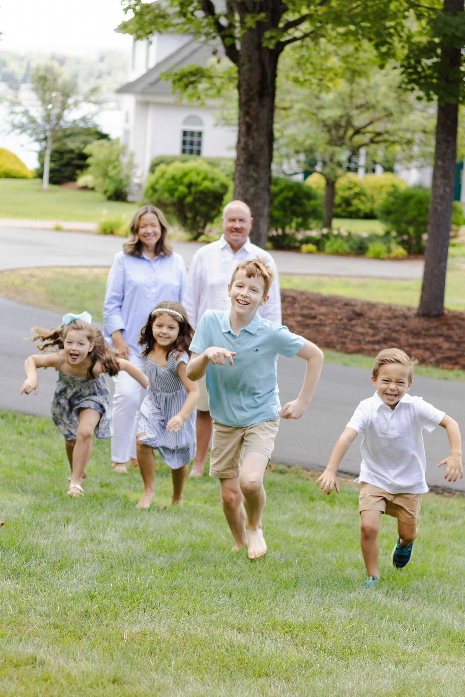 Photo of grandchildren running away from grandparents
