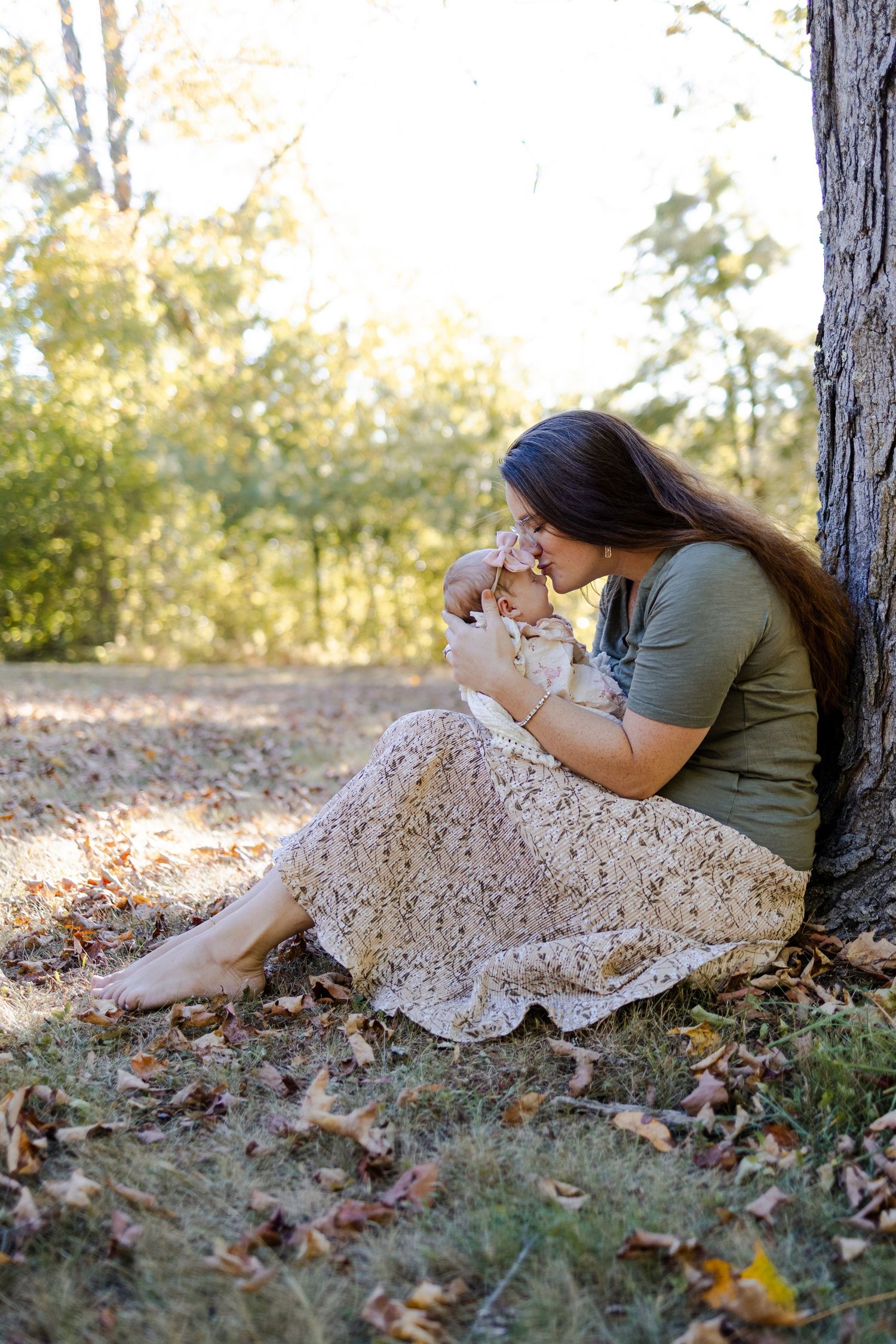 A series of outdoor portraits showing someone resting against a tree trunk in autumn leaves.