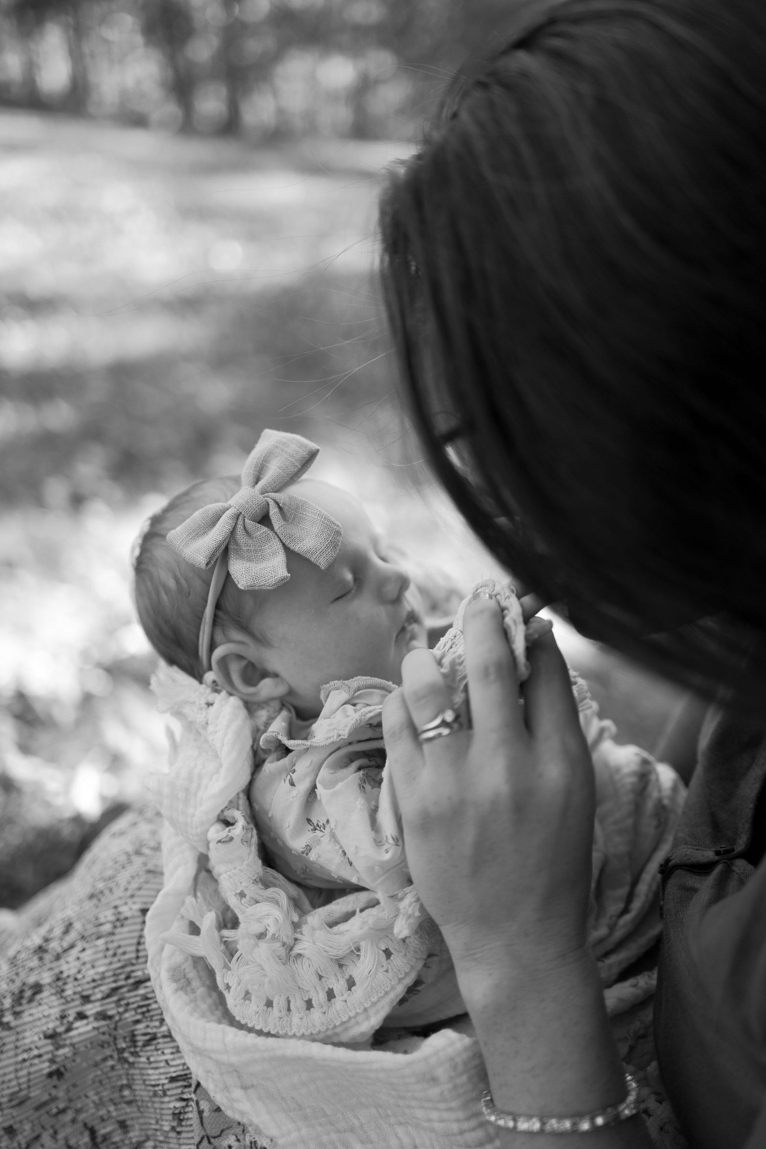 Photo of a young baby and mother embracing