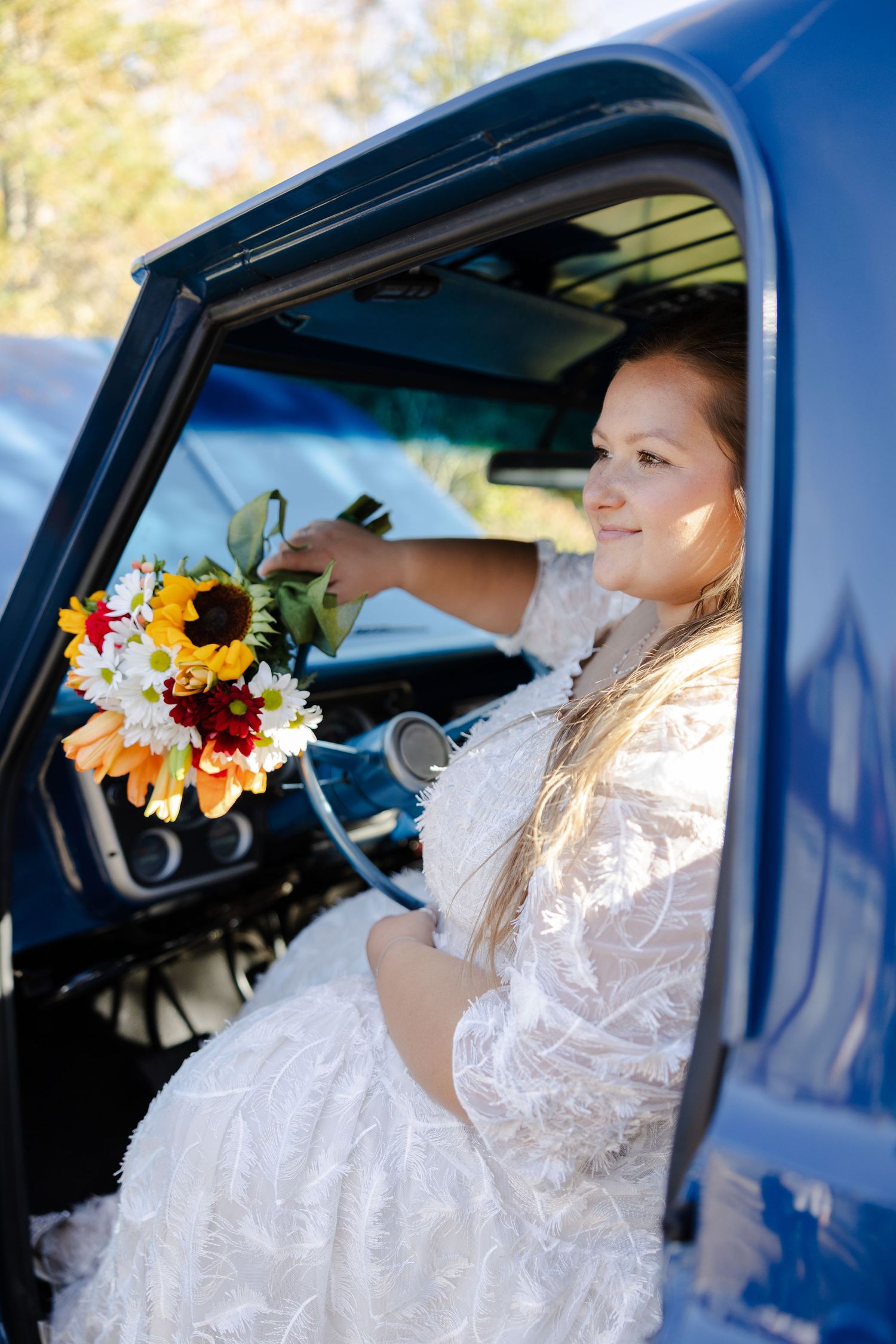 Portrait of bride in truck