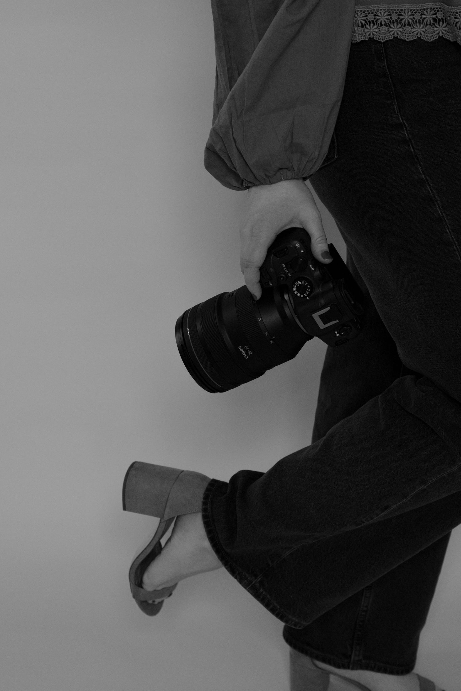 Black and white artistic photo series showing close-up details of someone wearing dark clothing and boots.