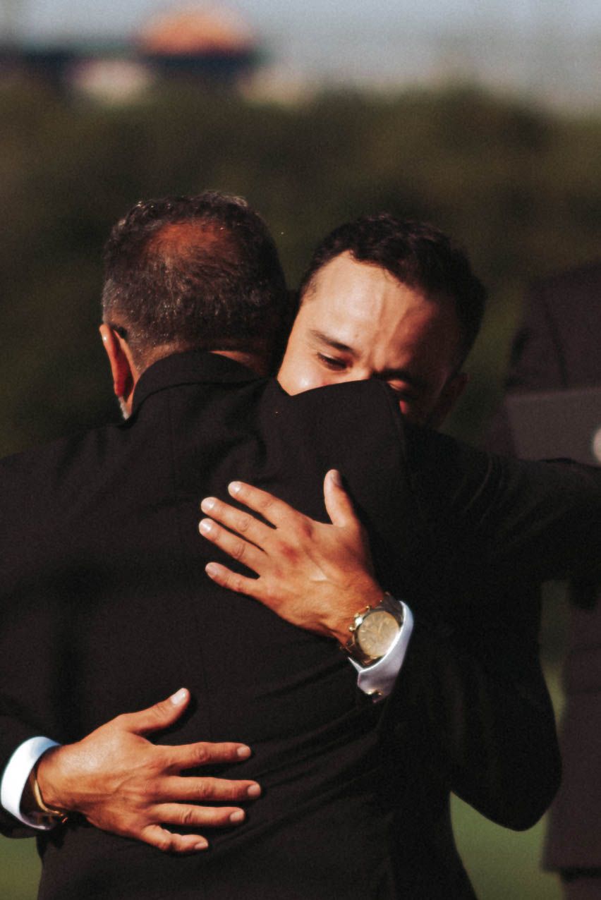 Two people share an emotional embrace in a series of progressive photos showing support and compassion.
