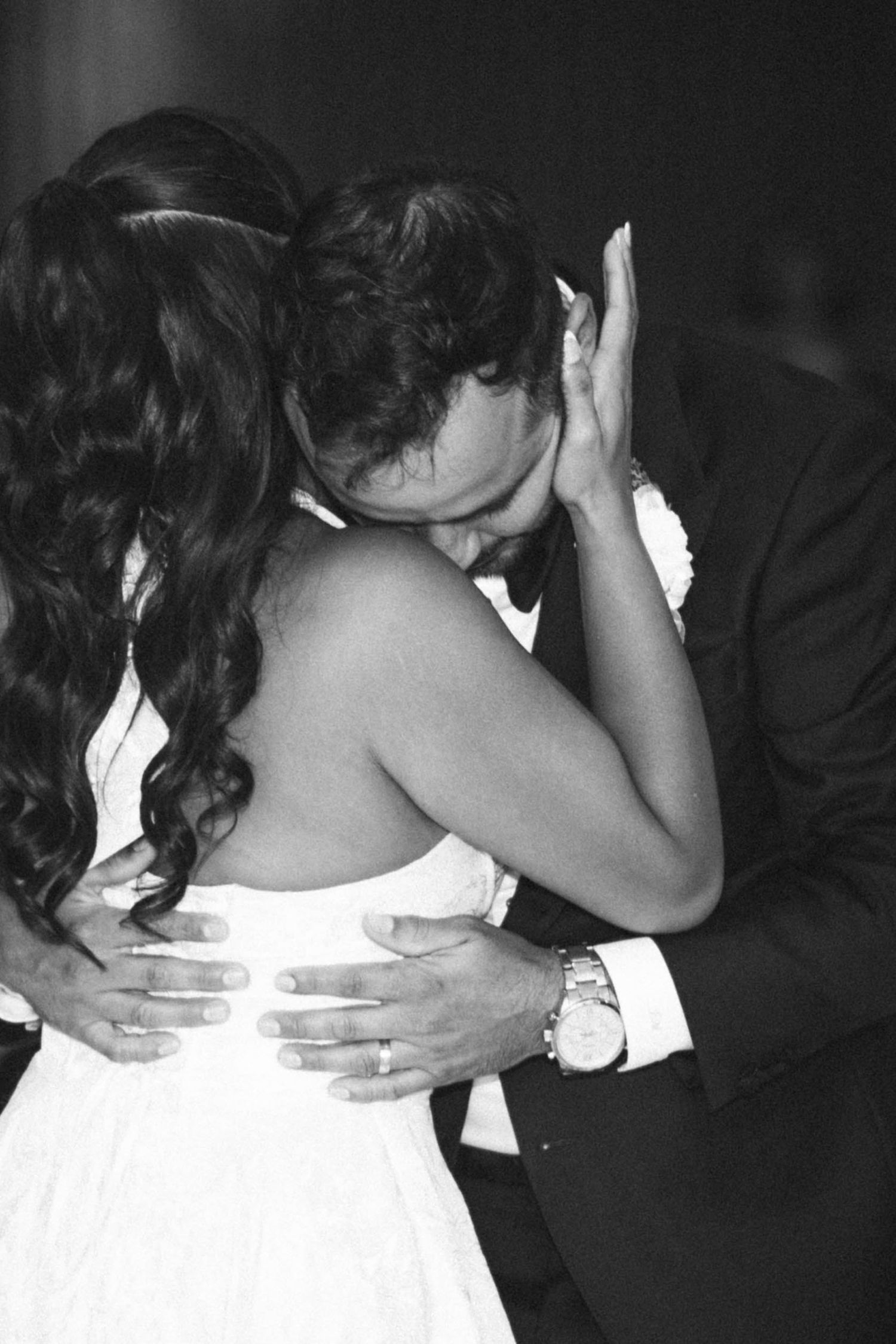 A black and white photo sequence shows a couple in wedding attire sharing an intimate kiss.