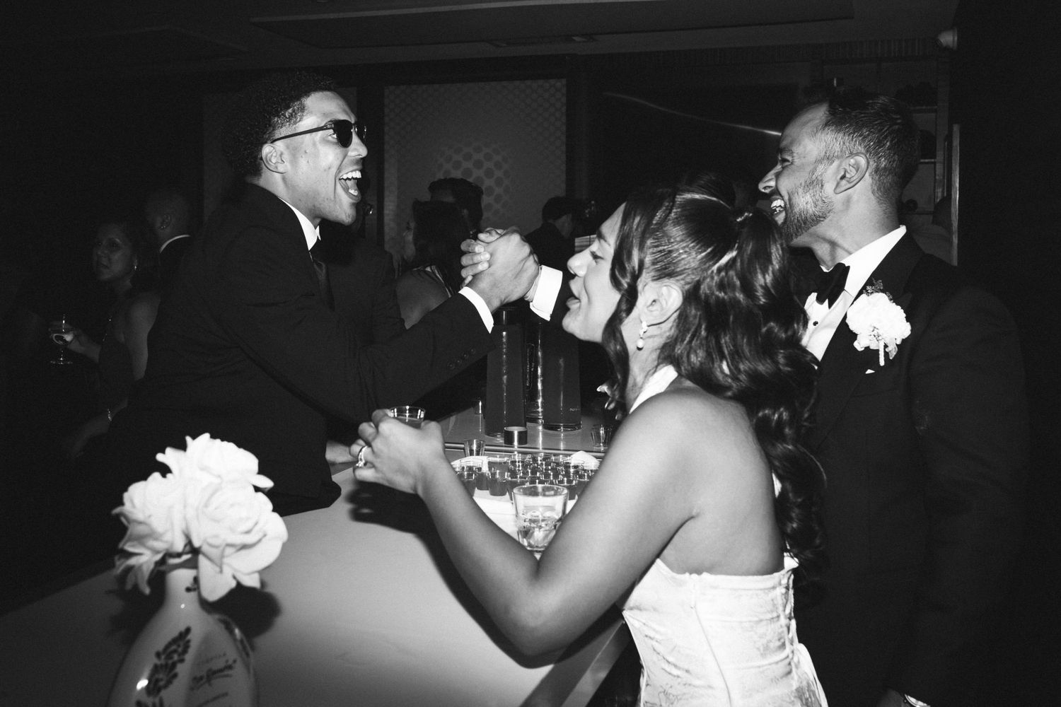 Couples dance together at a formal event in black and white vintage photograph.