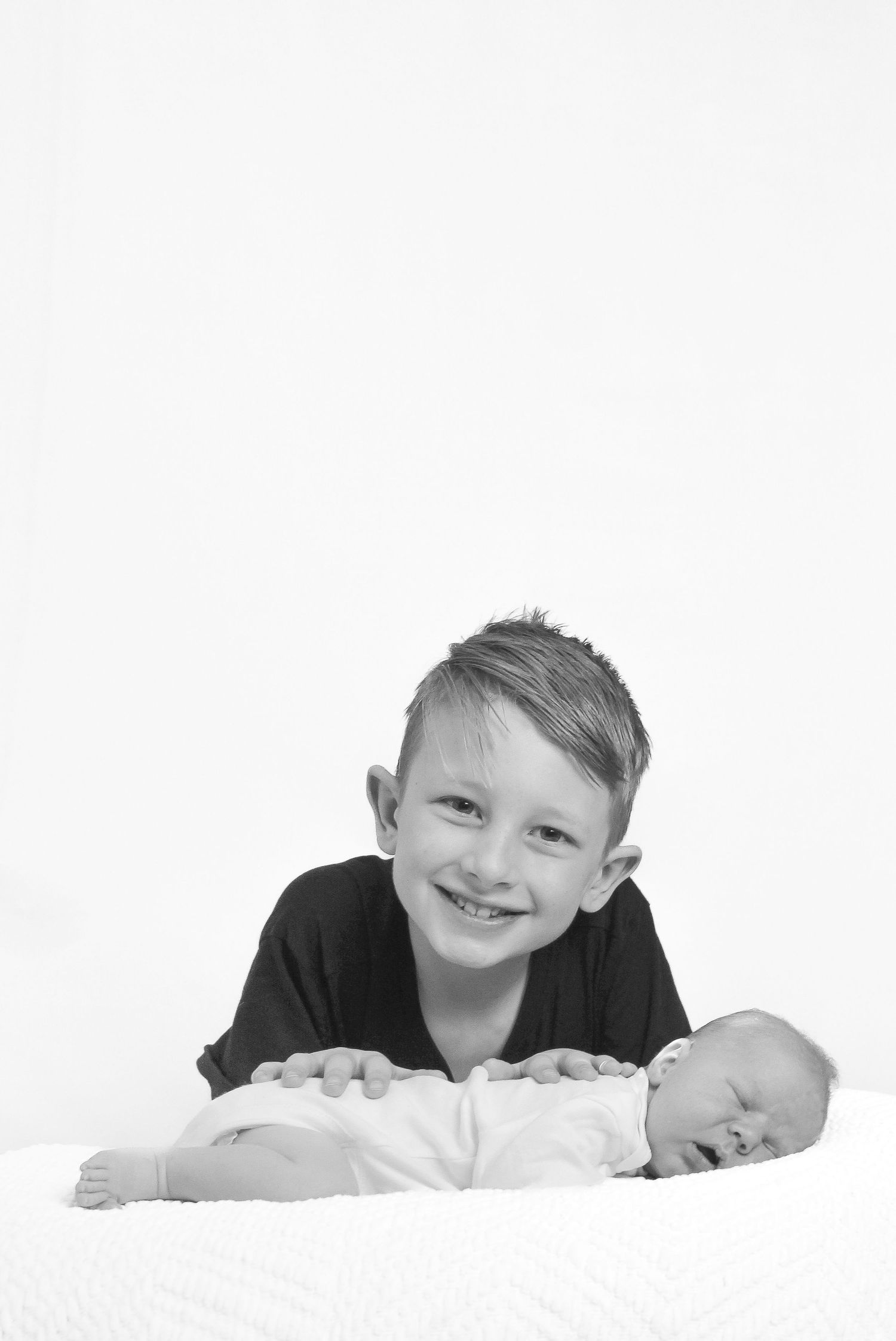 This big brother is obsessed with his newest sibling addition