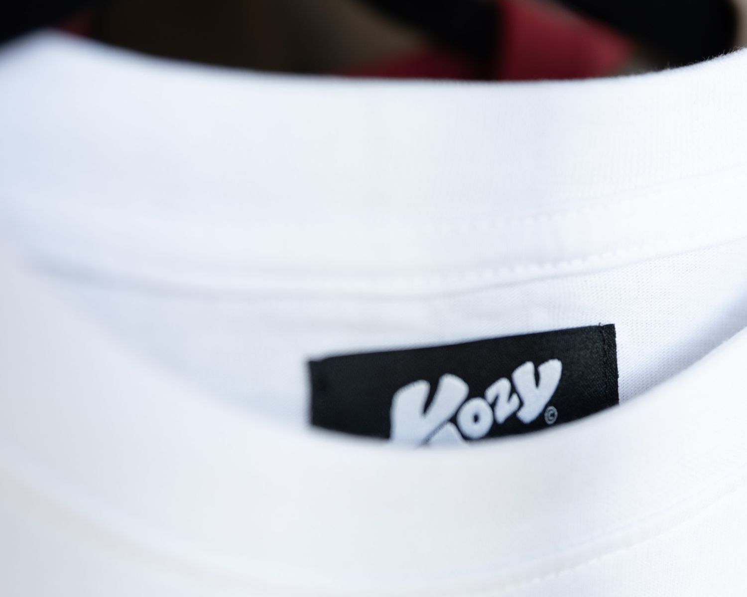 A row of white ceramic bowls with black labels sits on a light colored surface.