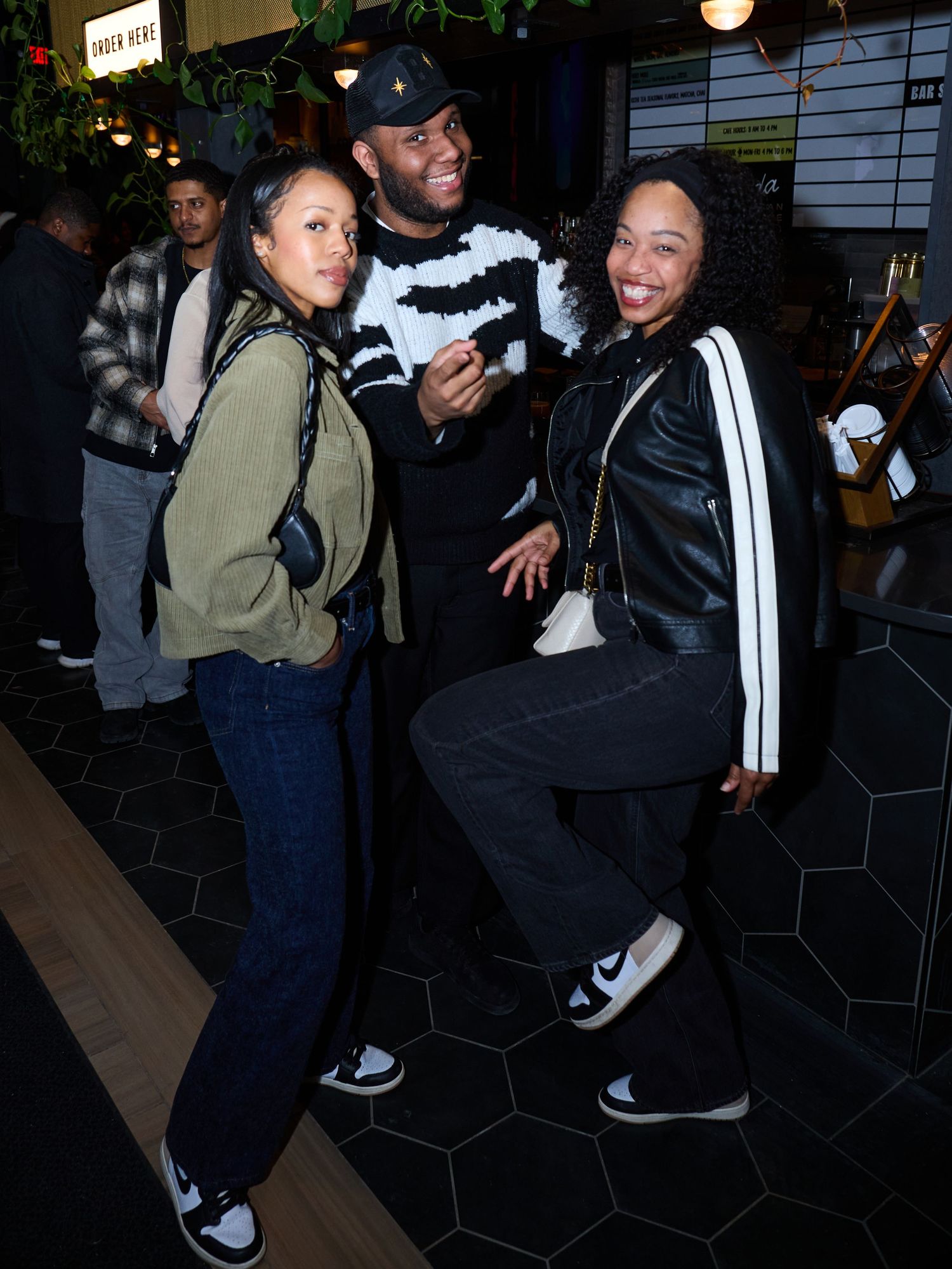 Four sequential photos show people dancing and socializing in a dimly lit indoor venue with tiled walls.