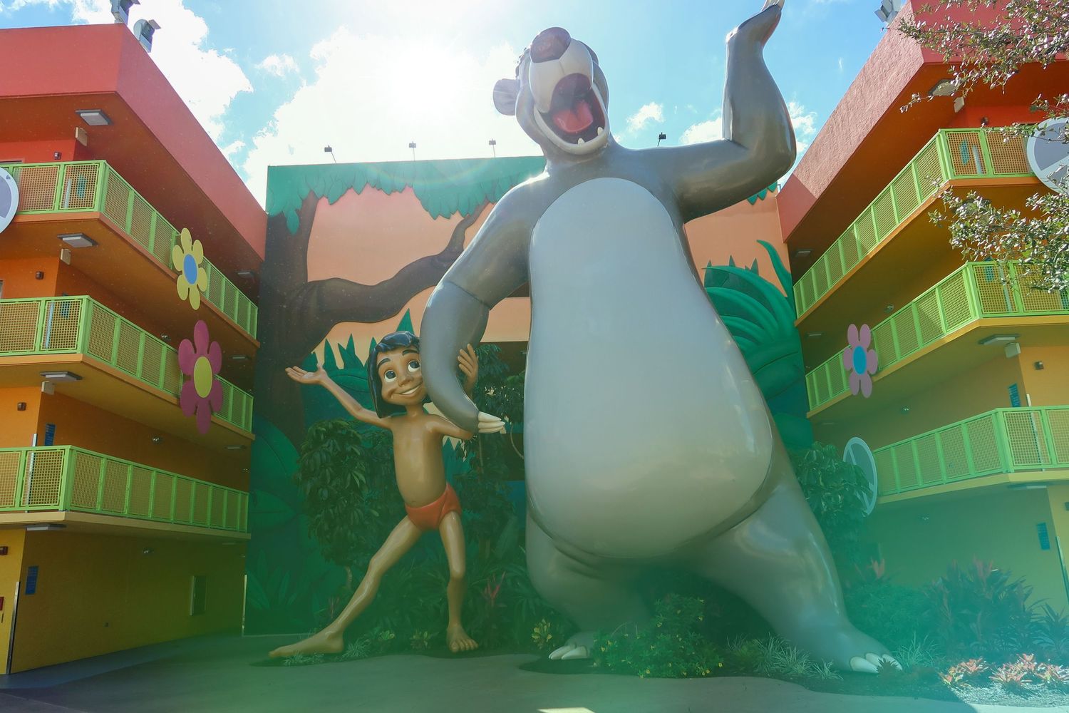 Giant Baloo and Mowgli statues from The Jungle Book at Disney's All-Star Movies Resort.