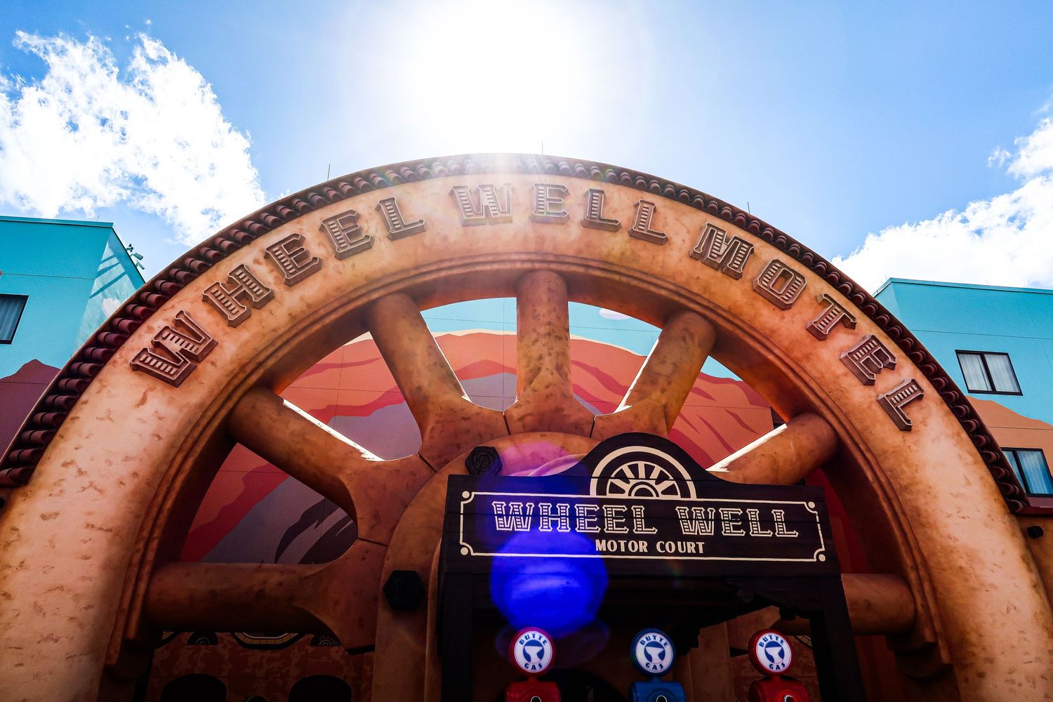 Wheel Well Motel entrance featuring a giant wagon wheel at Disney's Art of Animation Resort.