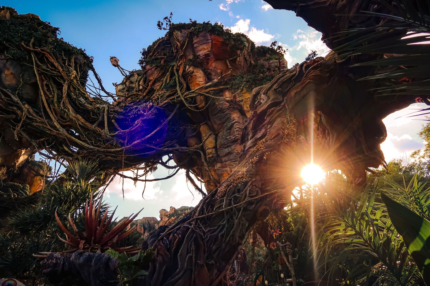 Pandora World of Avatar floating mountains glow at sunset in Disney's Animal Kingdom.