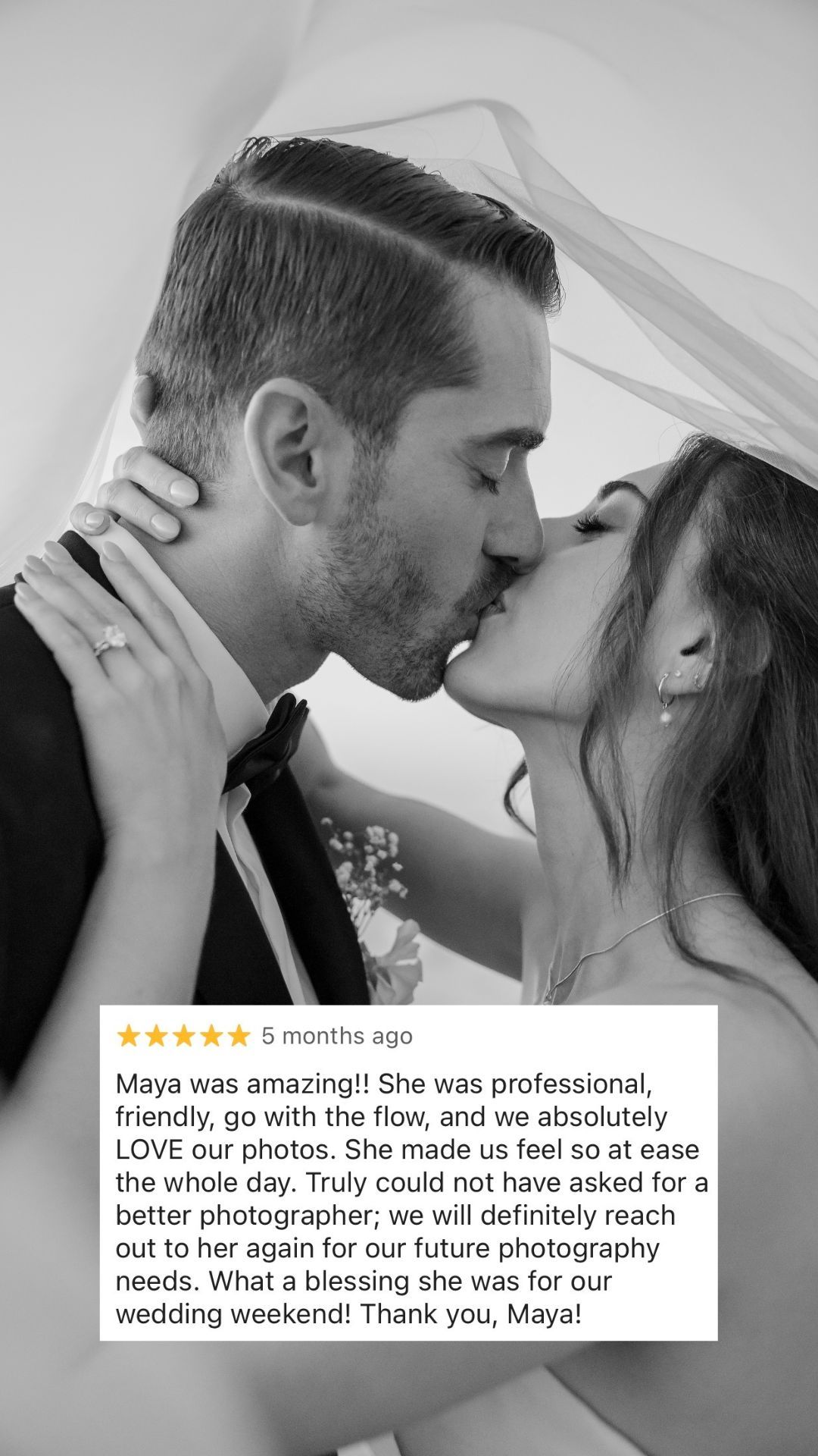 Black and white wedding photo of couple kissing under veil with 5-star review praising photographer Maya.