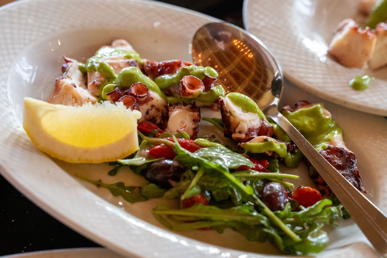 Gourmet plated salad served at elegant private event