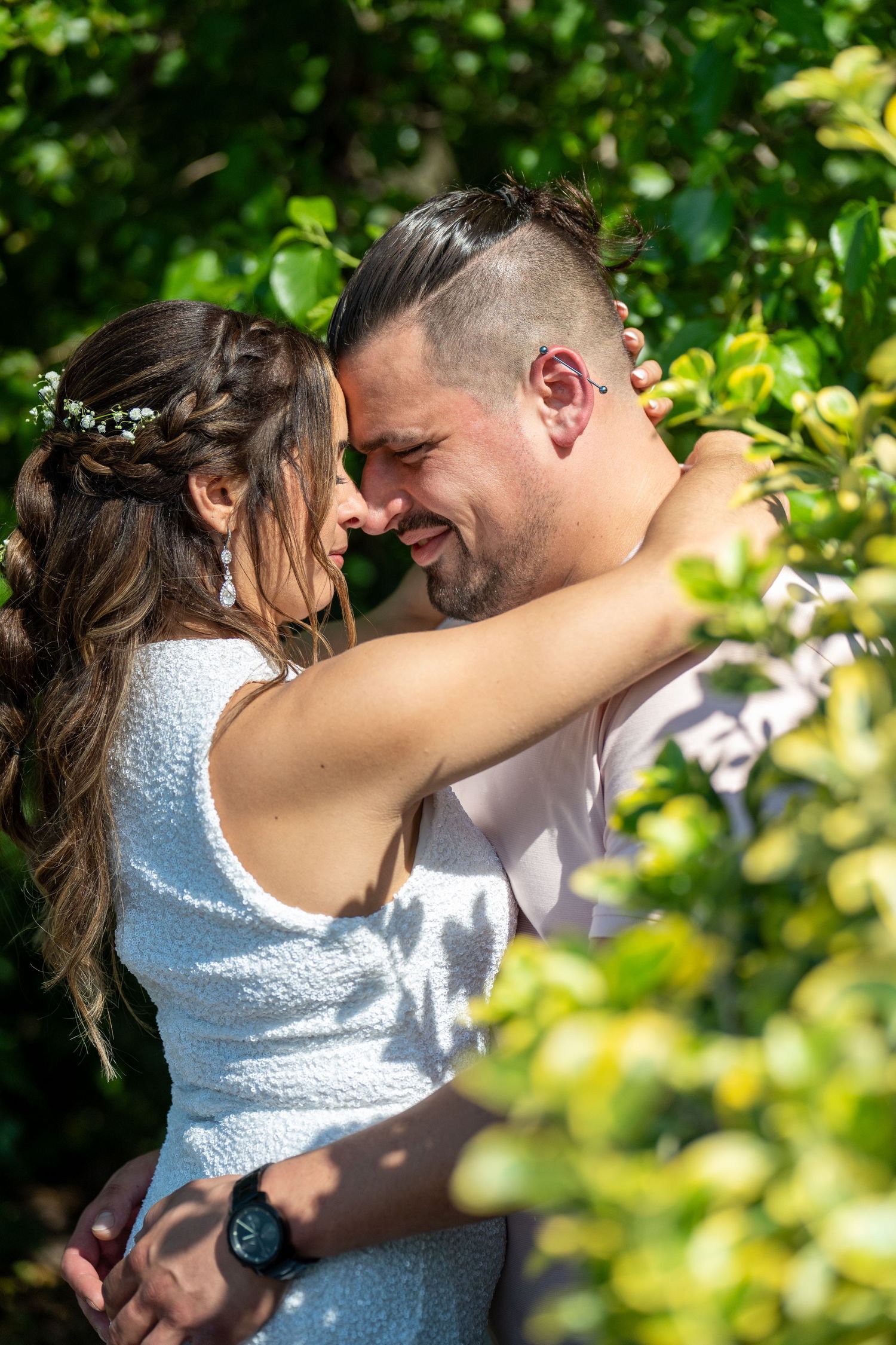 Couple embracing outdoors in natural greenery