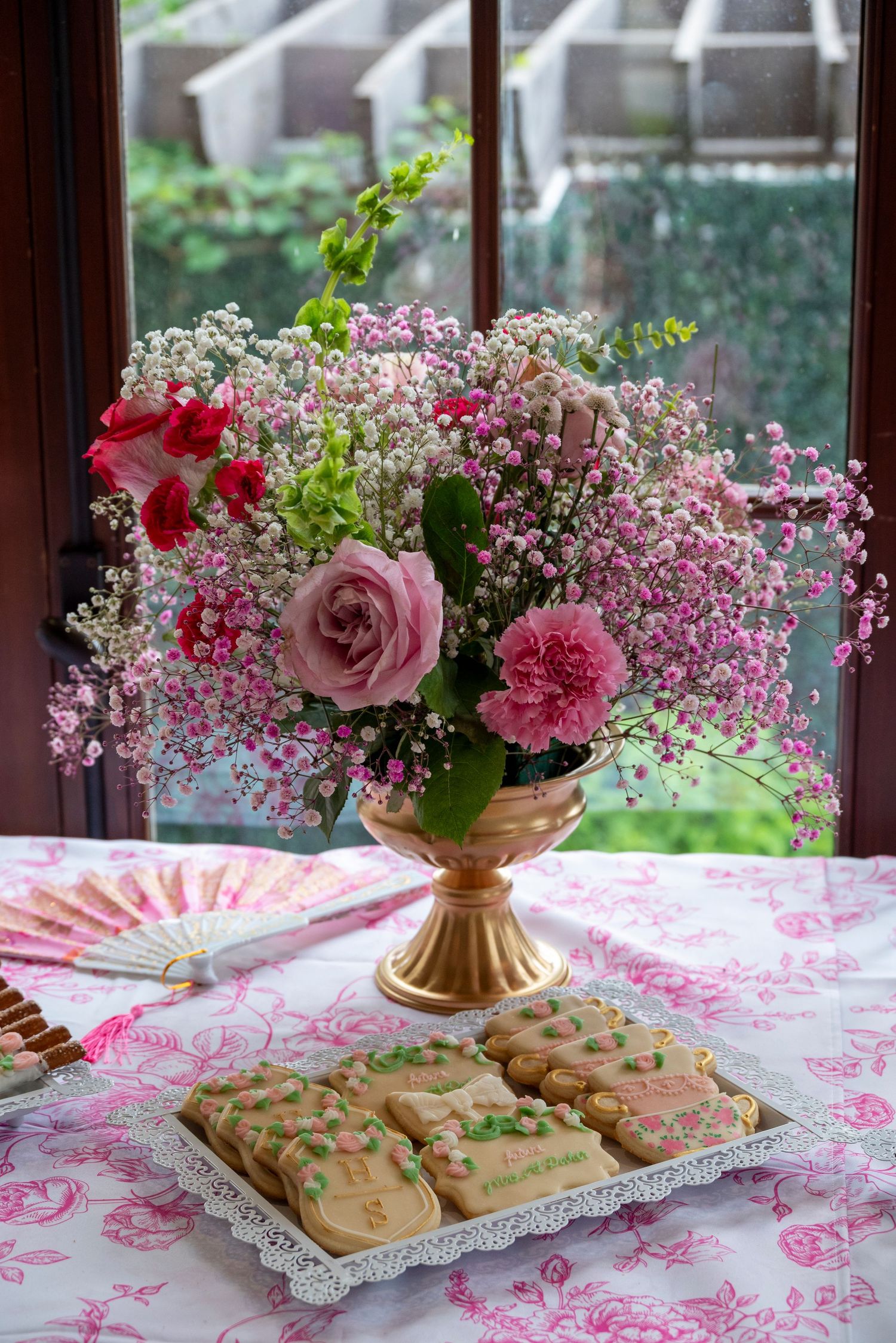 Bridal shower welcome sign surrounded by flowers