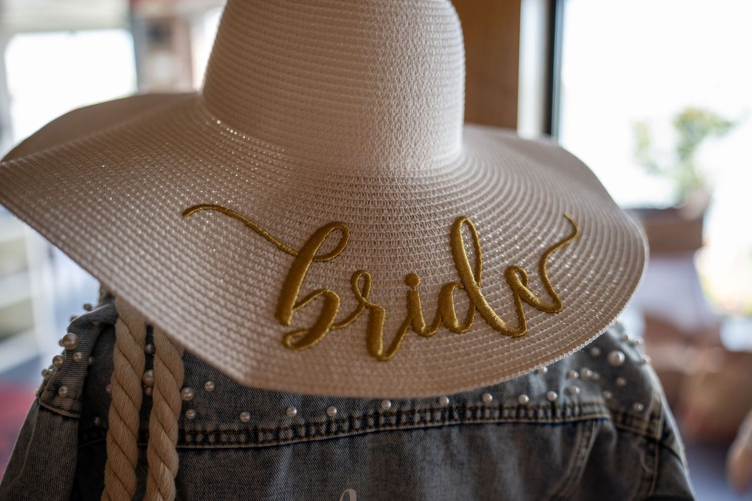 Custom cake with “Bride” topper at bridal shower