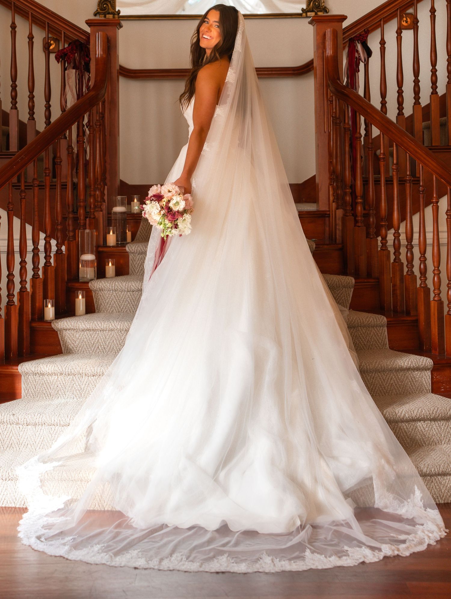 Series of wedding dress details showing flowing train on wooden staircase.