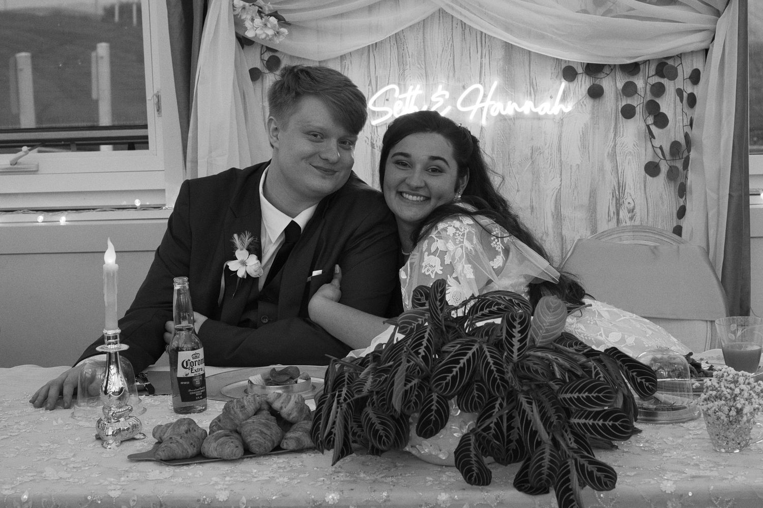 Candid bride and groom smile for the camera