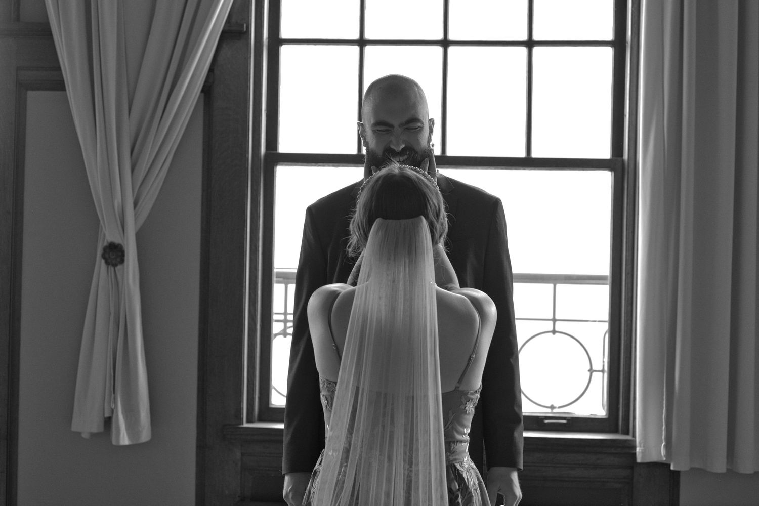 Bride's veil running down her back as she looks up at groom in Eastern Washington