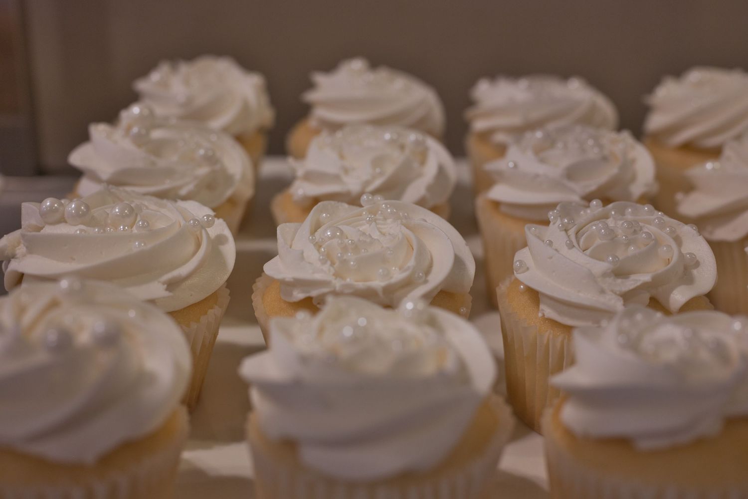 White cupcakes with pearl sprinkles