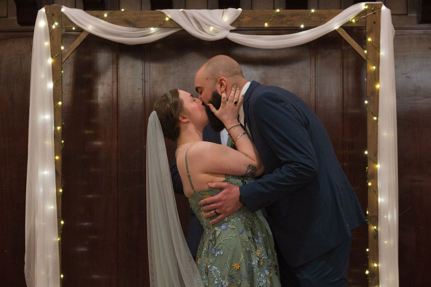 Bride and groom kiss during the ceremony