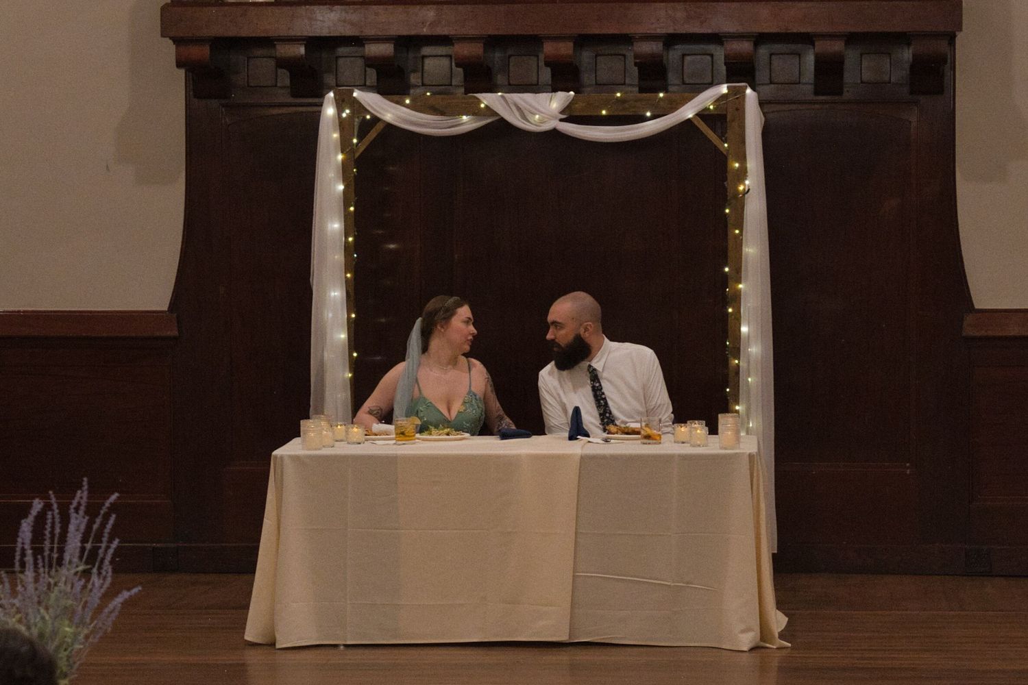 Bride and groom eating during reception